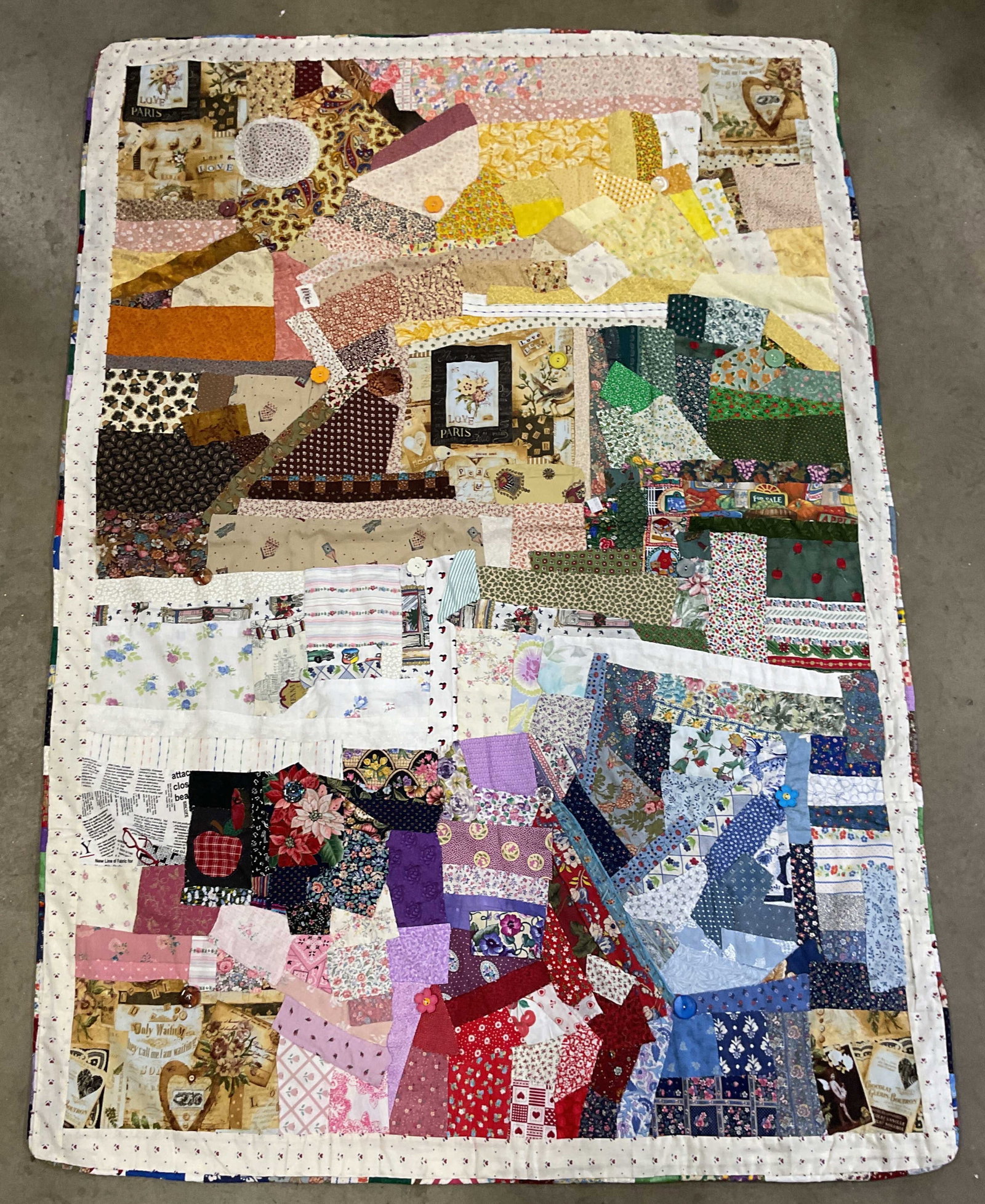 Hand Pieced Patchwork Abstract Cotton Quilt: Hand pieced cotton quilt. Abstract pattern with graphic prints and button decoration. Measures approx. 64 x 44 inches. Some wear consistent with exposure. Small tears. Quilt, handmade quilt, vintage