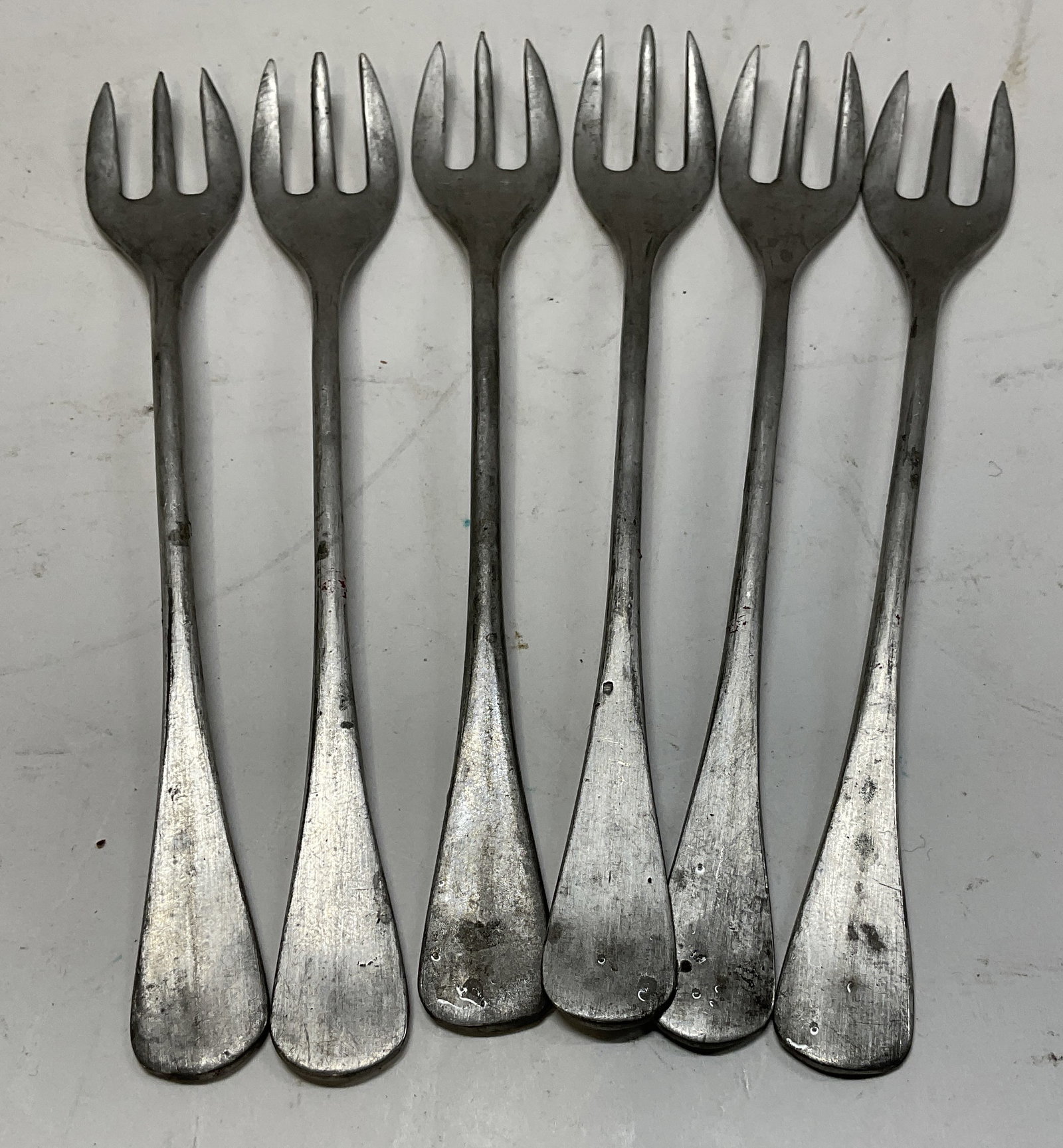 St6 Silver-Plated FRENCH Pickle Forks: Set of 6 Silver-Plated French 3-Pronged Pickle Forks. Marked Metal Francais. Scratching and Aging to Metal Present. Measures app 5.25in H x 0.75in W. Silver-Plate, French, 3-Pronged, Pickle Forks,