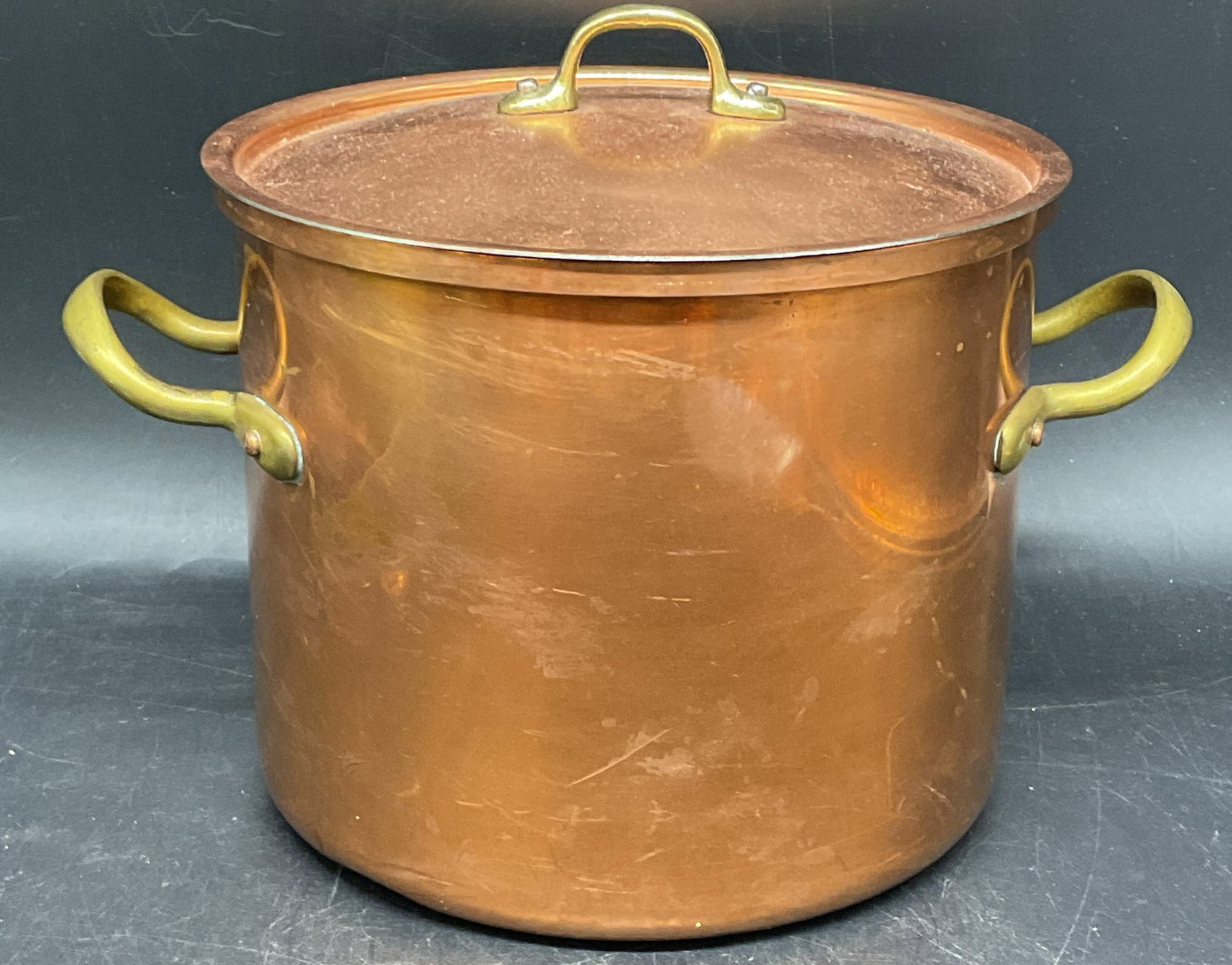 Vintage Copper Pot with Lid Portugal: Vintage copper pot with lid and brass handles. Made in Portugal. Measures approx. 7.5 x 6.25 inches. Some scratching. Copper pot, copper pot with lid, kitchenware, homewares, 10 cs