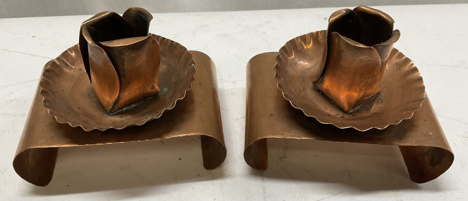 VTG Handmade Camp Rapputak Copper Candle Holders: Vintage Handmade Camp Rapputak Copper Rose Design Candle Holders. Curled Base Design. Tarnish Present. Measures app 3in H x 3.5in L. Vintage, Copper, Rose Design, Floral, Candle Holders, Curled Base, 
