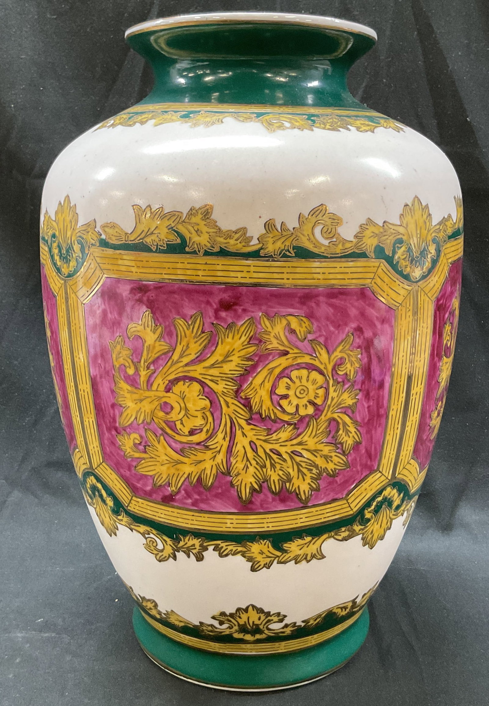 Vintage Porcelain Decorative Vase: Vintage porcelain decorative case. Round base with bulbous body. Gilt rim. Hand painted floral and scroll motifs. Purple, green, white, gilt. Measures ht approx 12.5 inches diam approx 5 inches. Surfa
