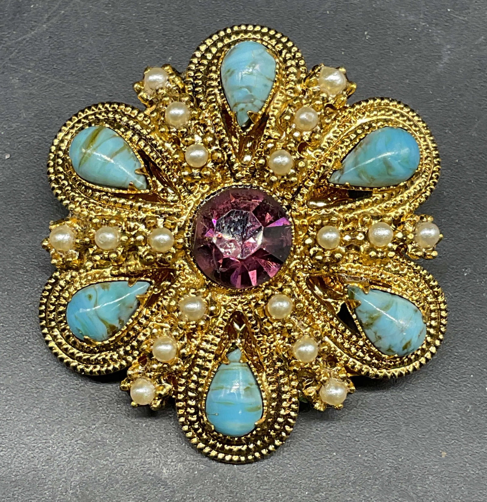 Vintage Gold Tone Crystal Flower Brooch: Vintage gold tone flower brooch with faux pearl and crystal. Measures approx. 1.5 inches wide. Some scratching. Jewelry, estate jewelry, costume jewelry, cocktail jewelry, fashion jewelry, accessories