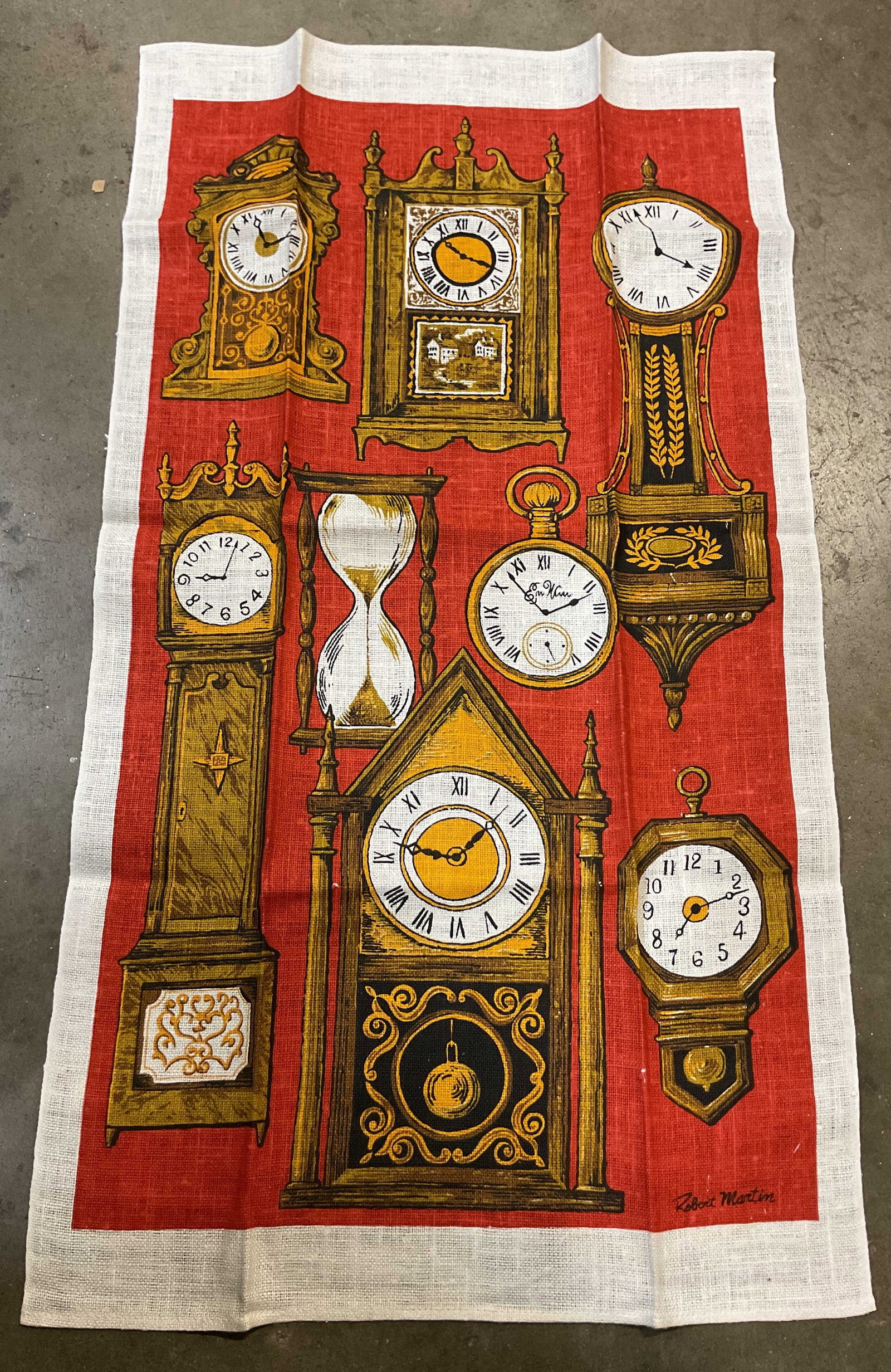 Robert Martin Clock Pattern Linen Tea Towel: Robert Martin clock pattern linen tea towel. Marked Robert Martin. White border. Red background with various clock and timepiece motifs. Measures approx 17 x 30 inches. Surface wear consistent with ex