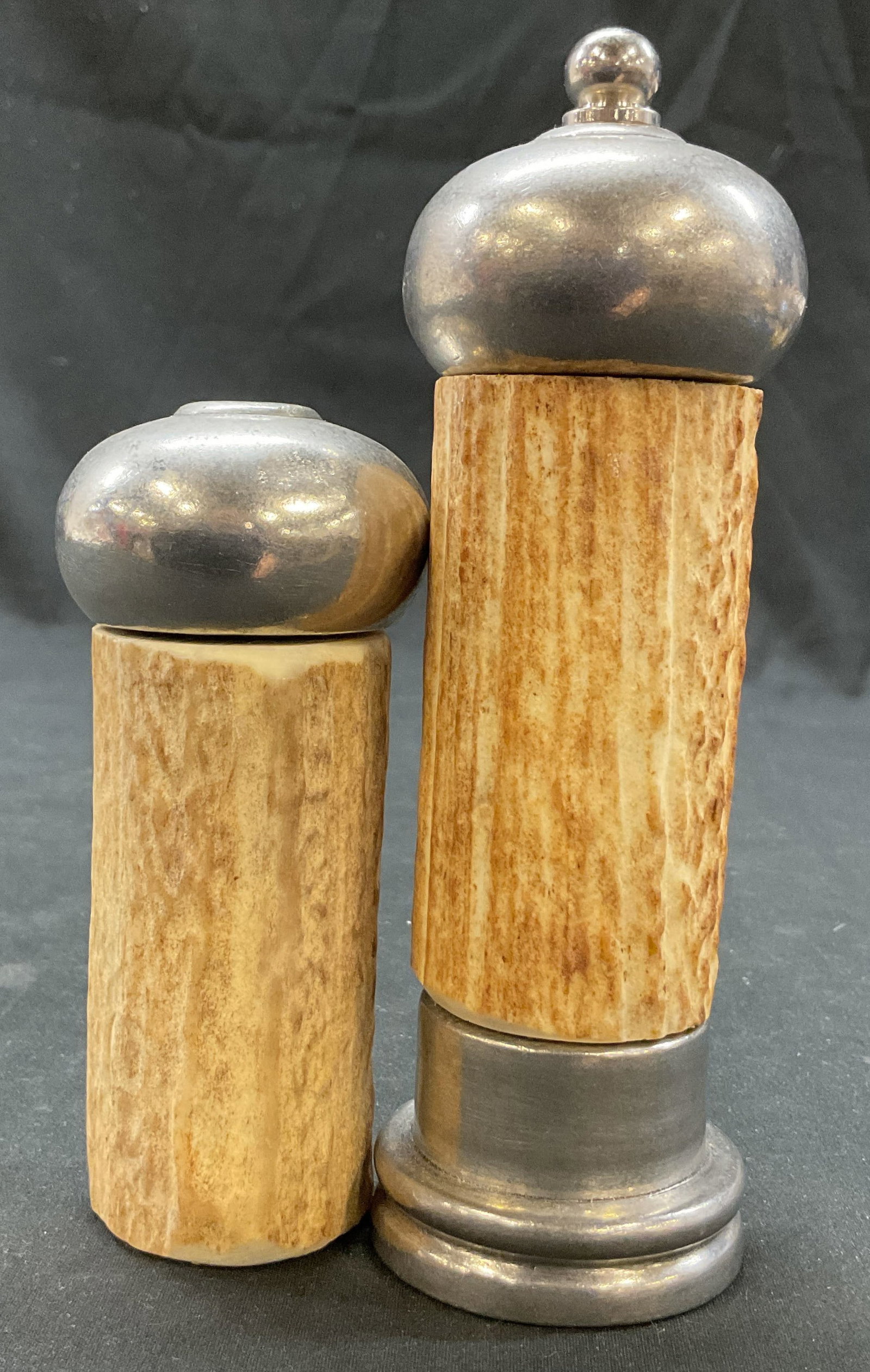 Vagabond House Elk Antler Salt & Pepper Shakers: Vagabond House Elk Antler salt and pepper shakers. Marked on underside. Silver plated tops. Measures ht approx 6 inches diam approx 4 inches. Surface wear consistent with exposure, as is. Salt and pep