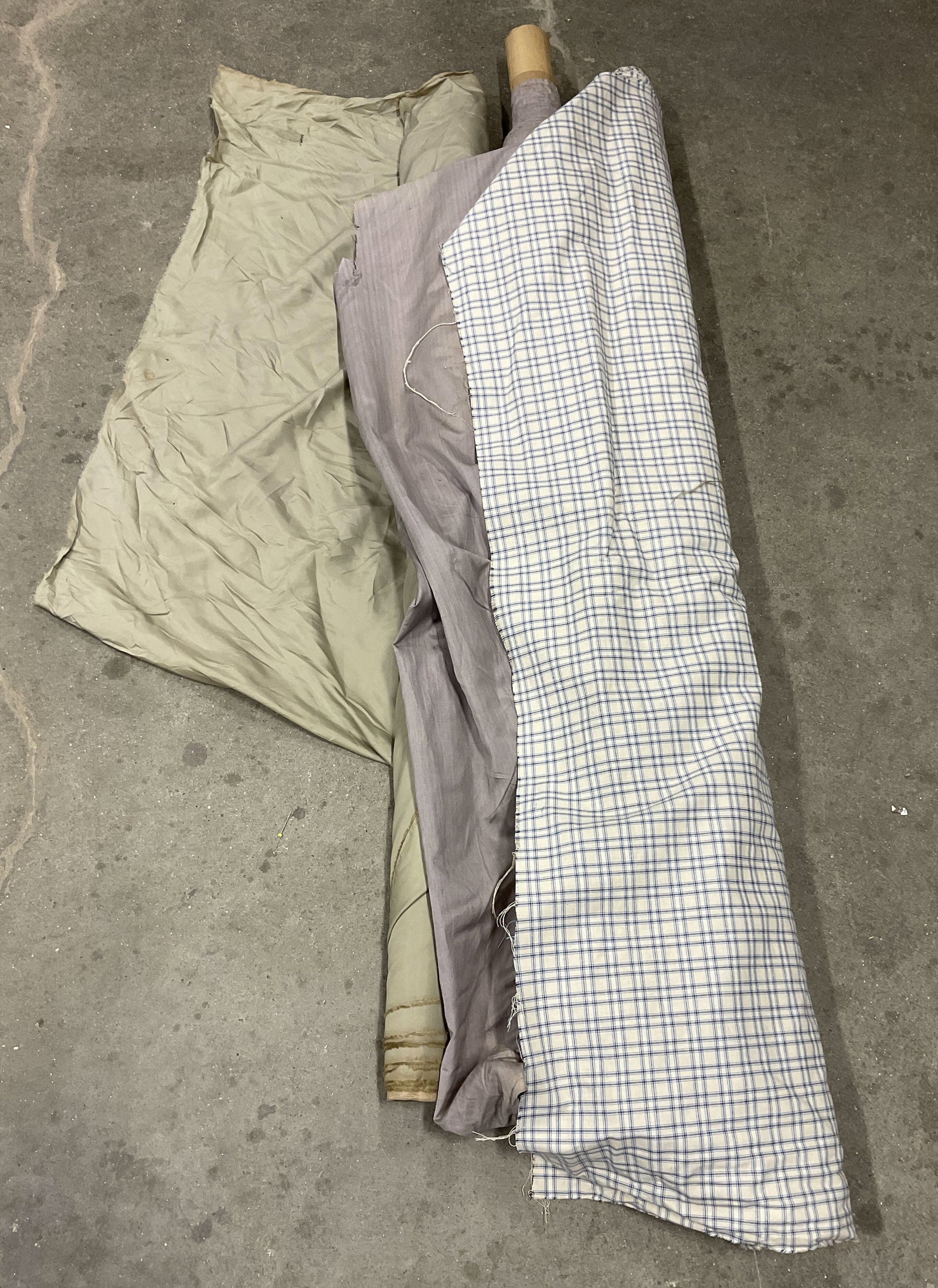 Lt 3 Solid and Plaid Bolts of Fabric: Lt 3 Solid and Plaid Bolts of Fabric. Mixed Materials. Silk, Linen, Cotton, and More. Purple, Green, and Blue Plaid. Not Measured, Unrolled, or Inspected. Sold As Is. Part of Large Collection of NYC I