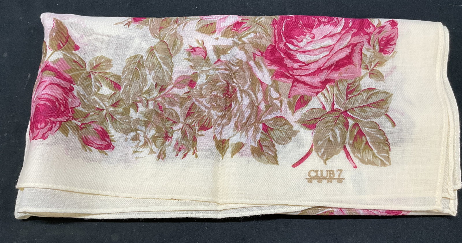 Club 7 Echo Floral Wool Scarf Japan: Club 7 Echo floral wool scarf. Made in Japan. Green and pink floral motifs. Cream background. Measures approx 28 x 29 inches. Wear consistent with exposure. Scarf, Club 7 Echo, wearables, clothing,