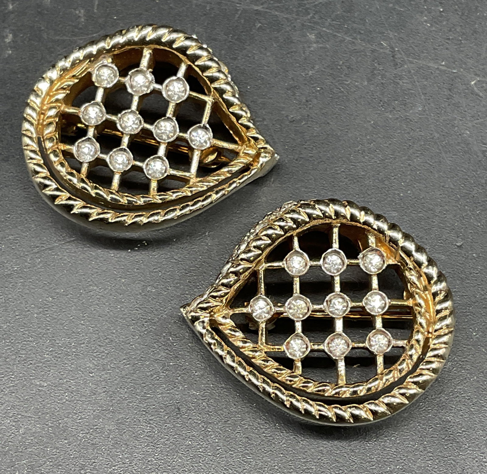 Pair Silver & Gold Tone Crystal Brooches: Pair of silver and gold tone crystal brooches. Measures approx. 1 x 1 inches. Some scratching. Jewelry, estate jewelry, costume jewelry, cocktail jewelry, fashion jewelry, accessories, fashion