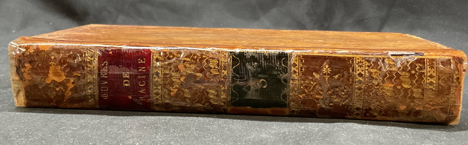 1813 Oeuvres De Jean Racine Volume 3 Book+: Oeuvres De Jean Racine. Volume 3. Published by M. Petitot, 1813. Text reads in French. Hard cover leather bound with embossed gilt trim and marble design. Measures approx 5 x 8 inches. Binding has