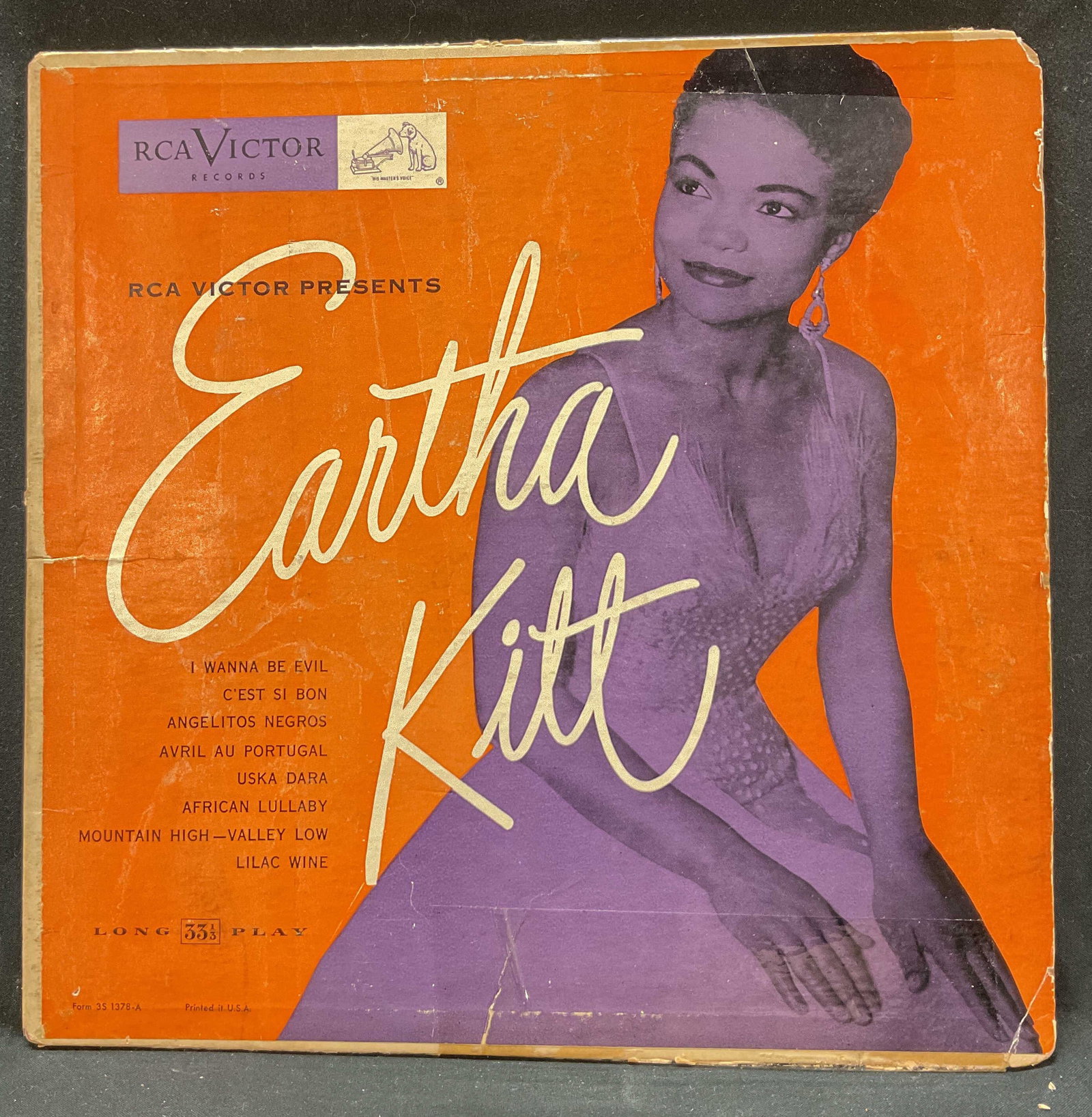 1953 Eartha Kitt 10in Vinyl Record: RCA Victor presents Eartha Kitt, 1953. 10 inch long play 33 1/3 vinyl record. Illustrations and text as photographed here. Measures approx 10 x 10 inches. Surface wear consistent to age, use, and