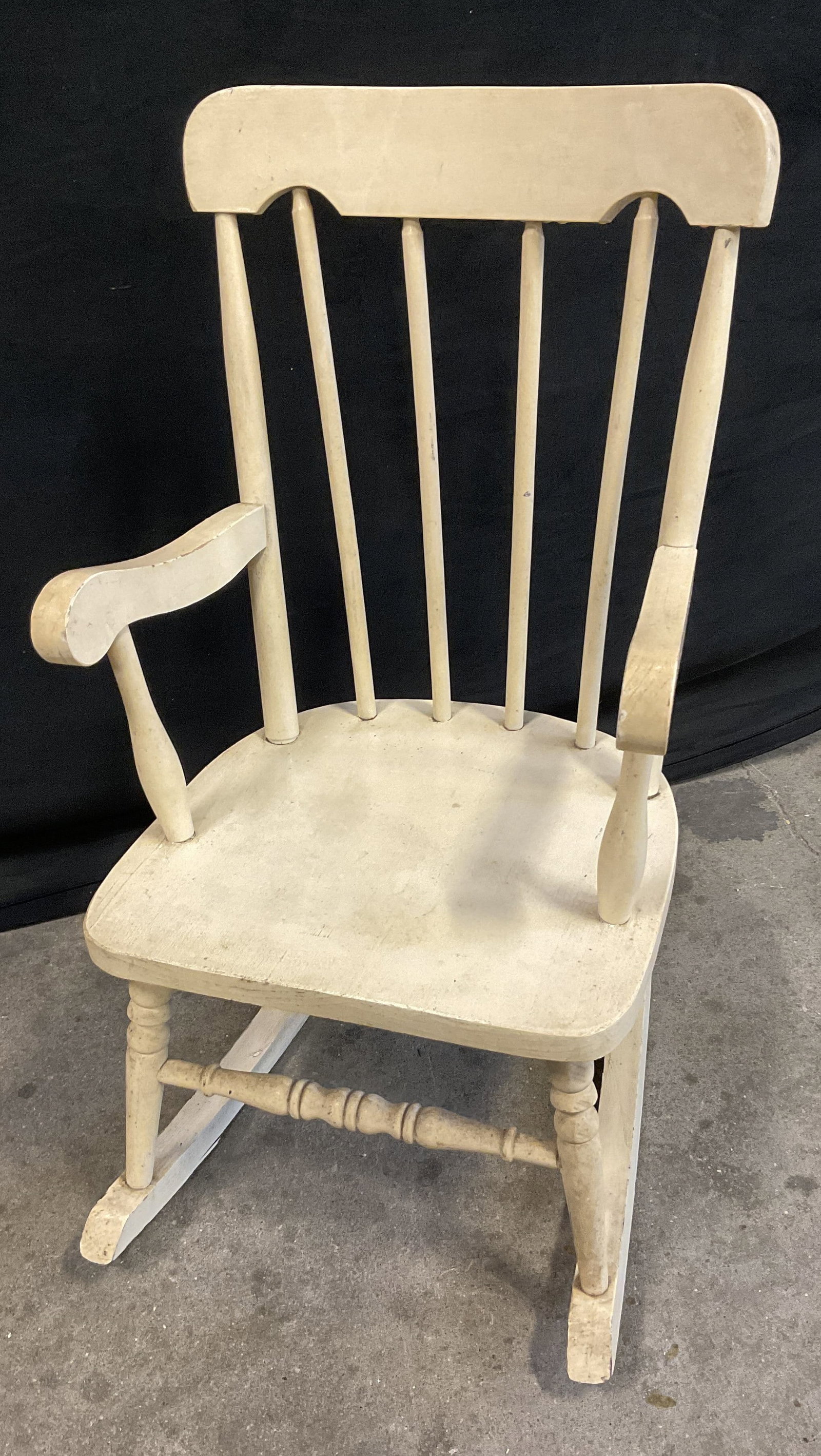 White Wooden Childrens Rocking Chair: Painted White Wooden Childrens Rocking Chair. Spindle Back. Rolled Armrests. Peeling to Paint. Measures app 28in H x 14in L x 23in W. Painted, White, Wooden, Childrens Rocking Chair, Small Rocker, Chi