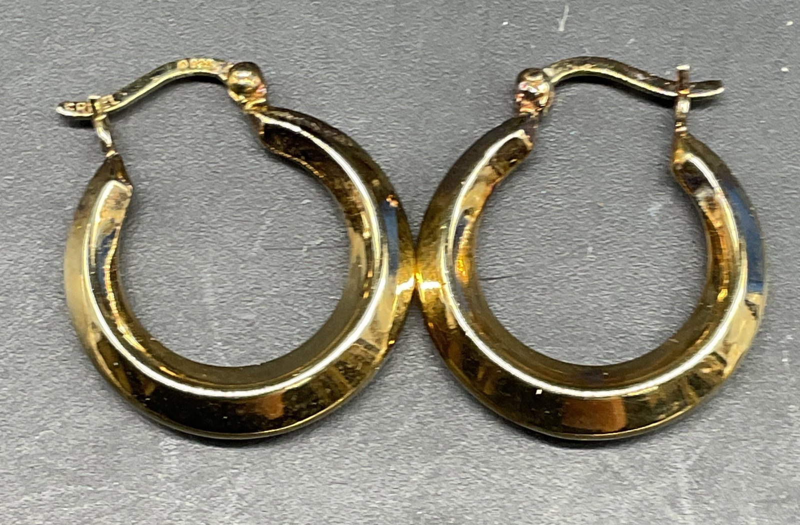 Sgn Gold Pl Sterling Silver Hoop Earrings, Israel: Signed gold plated sterling silver goop earrings. Measures approx. .75 inches wide. Marked sterling, signed illegibly. Total weight 2.1 grams. Some scratching. Jewelry, estate jewelry, fine jewelry, c