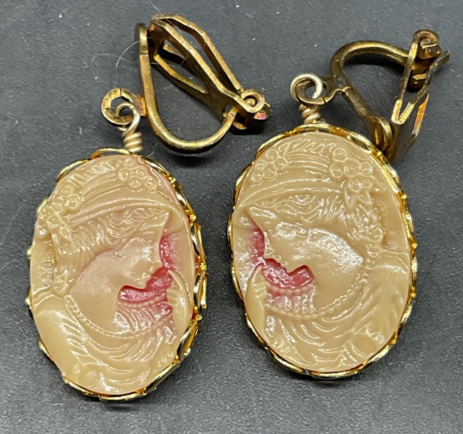 Vintage Faux Shell Cameo Earrings: Vintage faux shell cameo dangle earrings. Measures approx. .75 x .5 inches. Some scratching. Jewelry, estate jewelry, costume jewelry, cocktail jewelry, fashion jewelry, accessories, fashion accessori