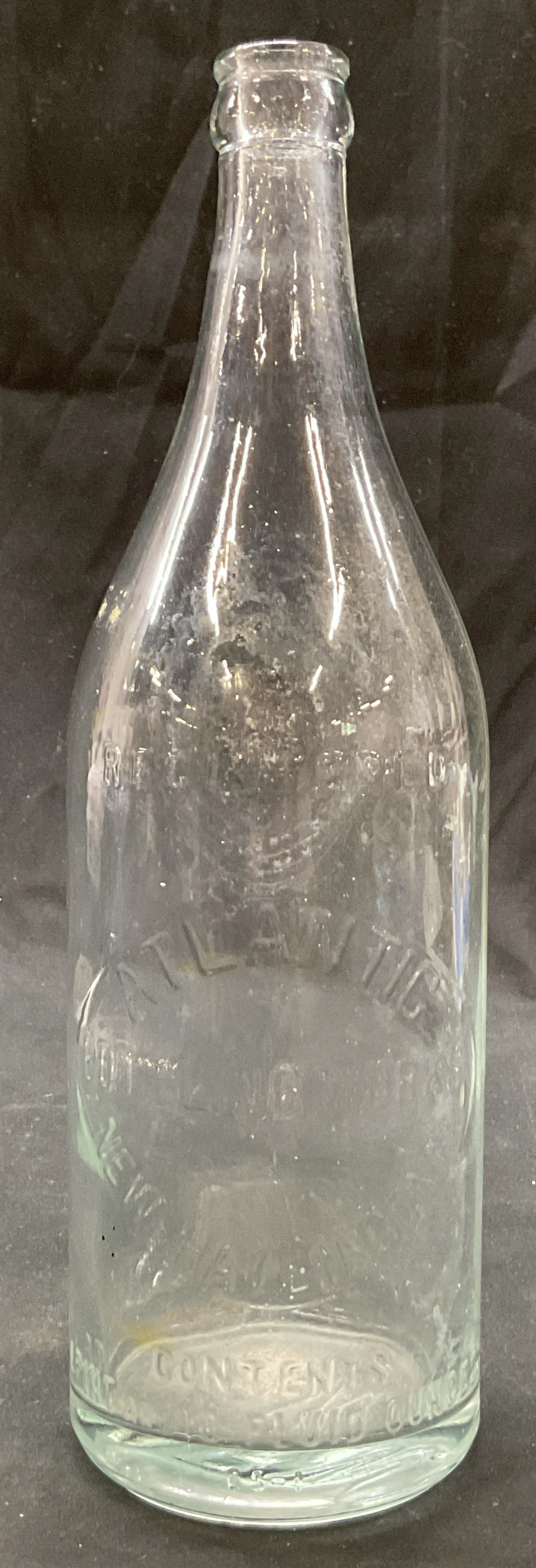 Vtg Atlantic Bottling Works Glass Bottle USA: Vintage glass bottle. Marked on surface, reads Registered Atlantic Bottling Works New Haven Conn Contents 1 Pint And 10 Fluid Ounces. Round base and narrow neck. Measures ht approx 11 inches diam appr