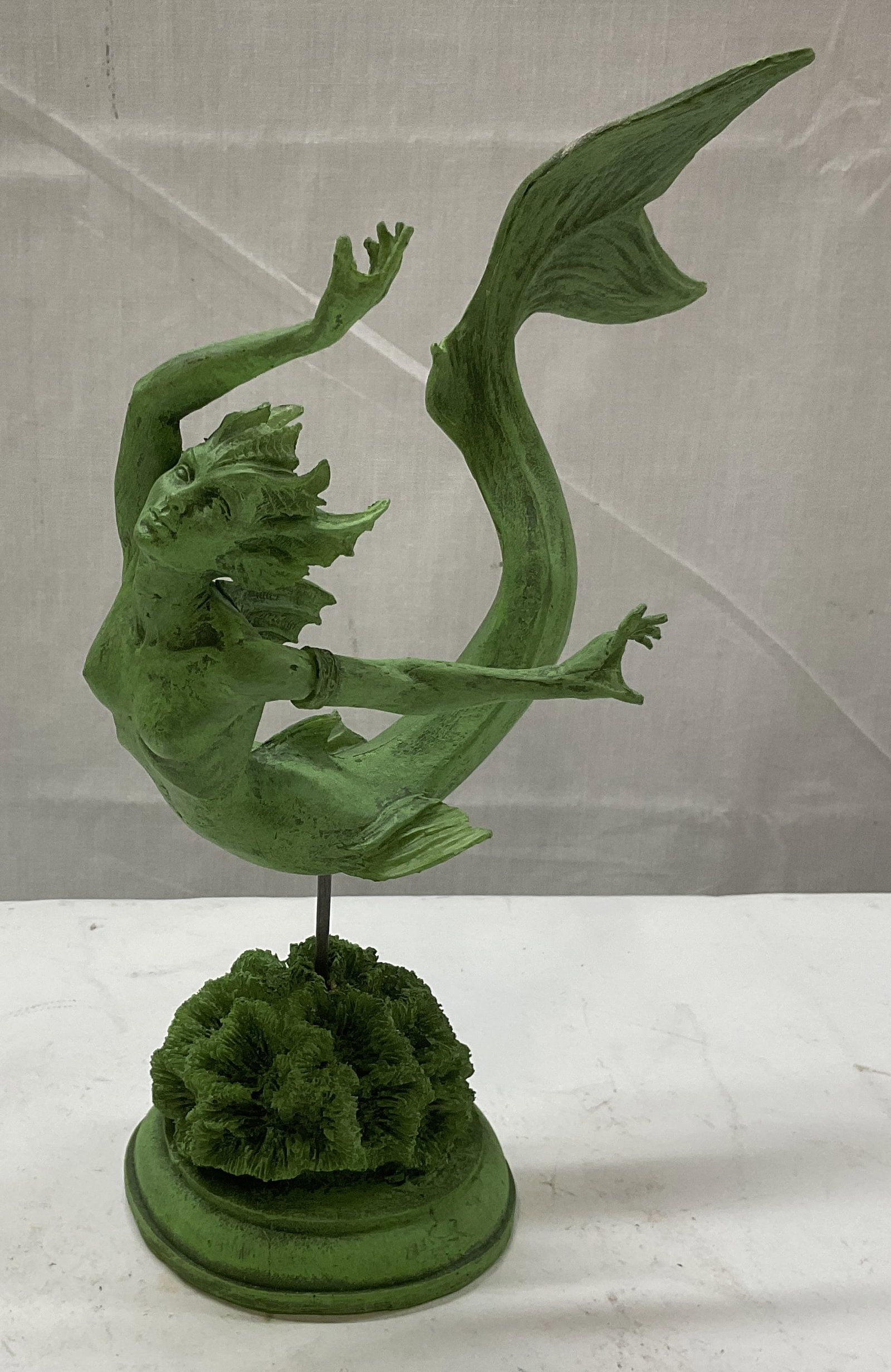 Jade Finish Mermaid Statue on Coral Stand: Jade Finish Mermaid Statue on Coral Stand. Made of Resin. Some Chips. Measures app 9in H x 7.5in L x 3.5in Base. Jade Finish, Green, Mermaid Statue, Mermaid Figurine, Coral Stand, Ocean, Fantasy Art, 