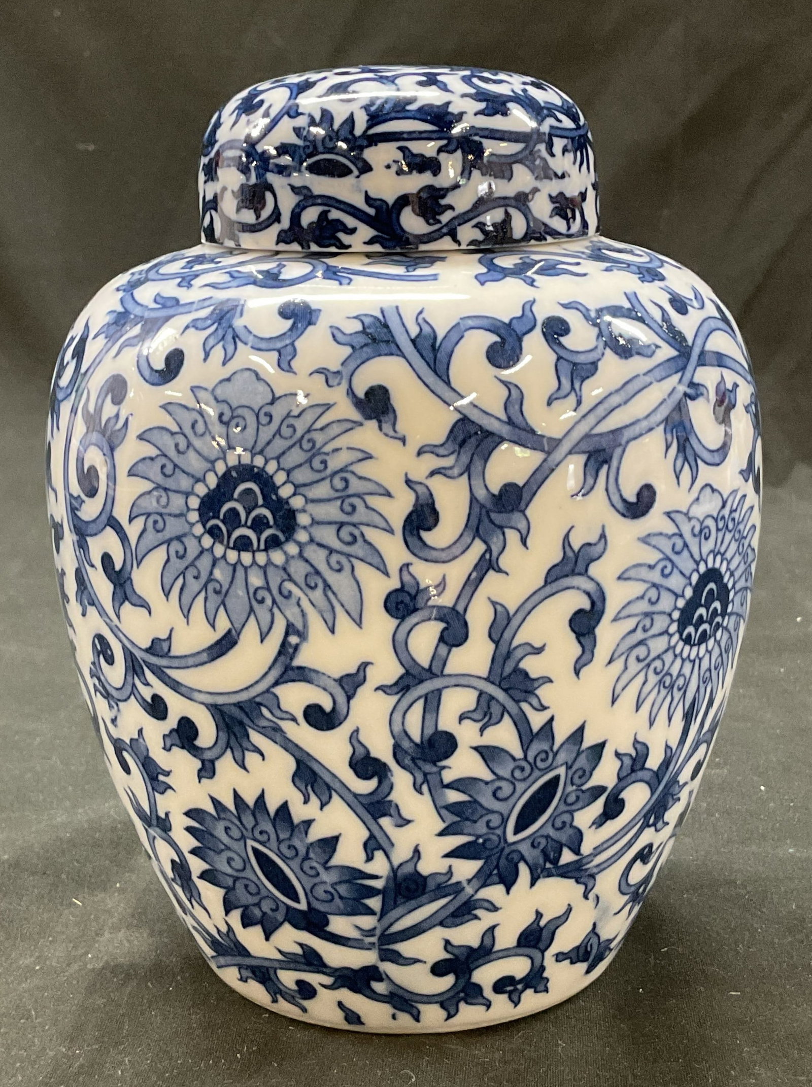 Vtg Porcelain Blue & White Lidded Ginger Jar: Vintage porcelain blue and white lidded ginger jar. Bulbous body with domed lid. Blue and white floral and scroll motifs. Measures ht approx 6 inches diam approx 3 inches. Surface wear consistent with
