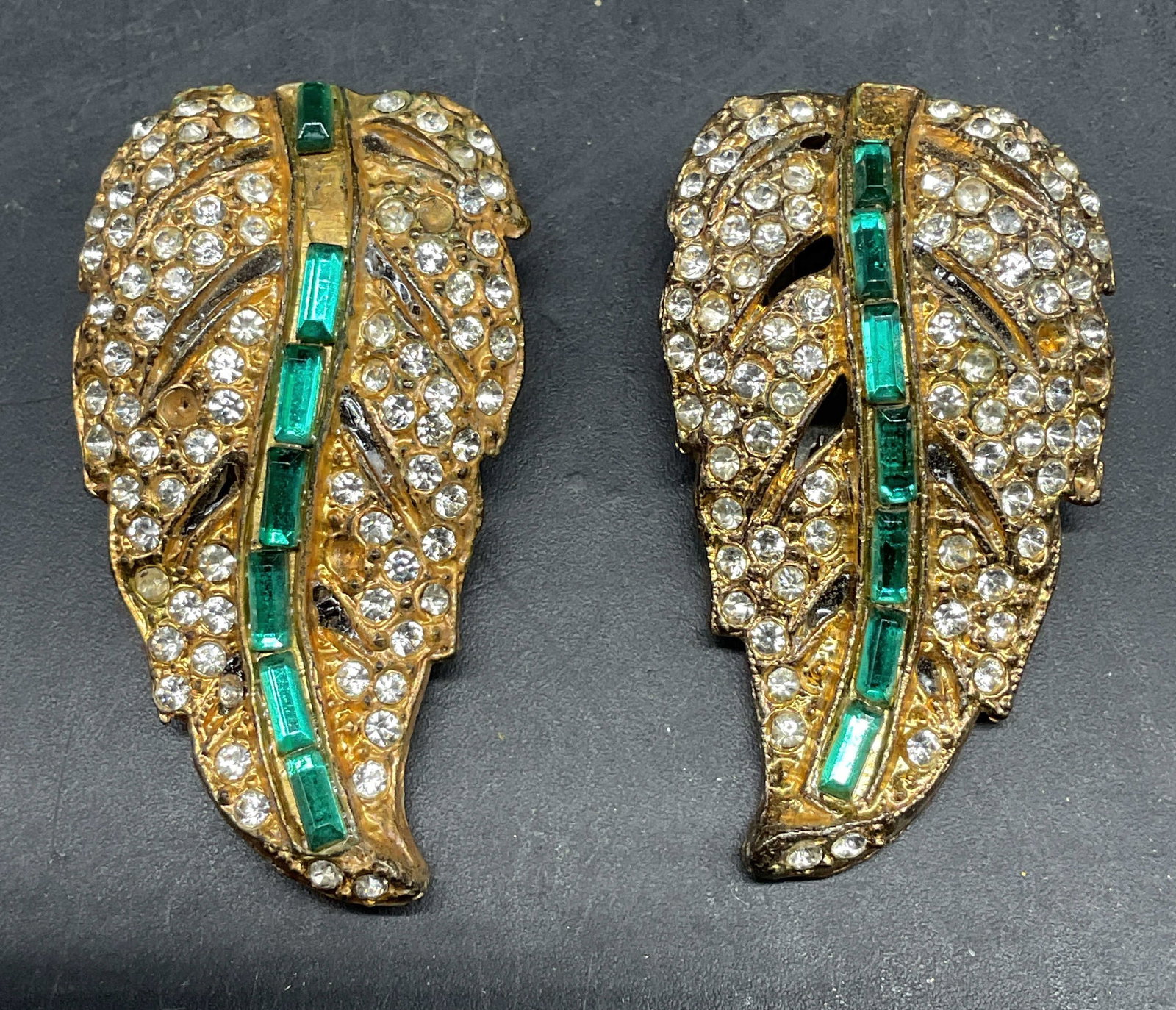 Pair KB Gold Tone Rhinestone Fur Clips: Pair of vintage KB gold tone rhinestone leaf shaped fur clips. Measures approx. 1.5 x 1 inches. Some rhinestones need replacement. Some scratching. Jewelry, estate jewelry, costume jewelry, cocktail j