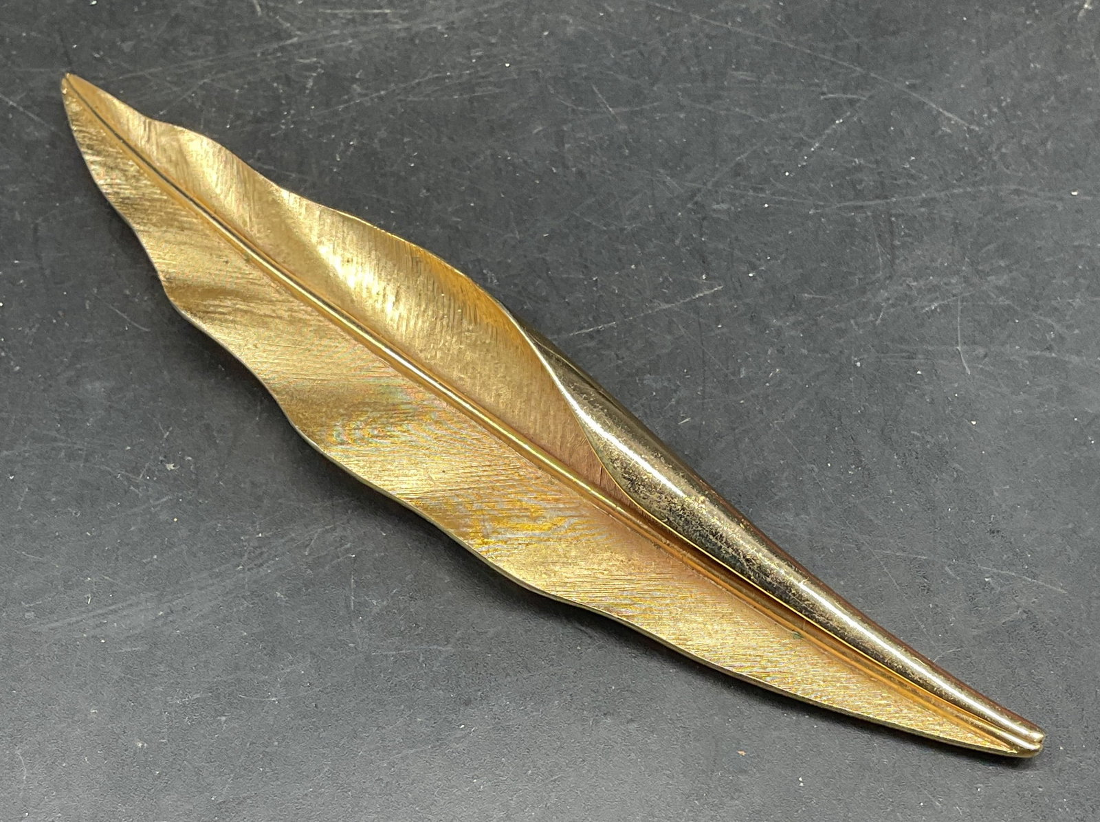 Trifari Gold Tone Leaf Brooch 5.25 Inches: Vintage Trifari gold tone leaf motif statement brooch. Measures approx. 5.25 x 1 inches. Some scratching. Jewelry, estate jewelry, costume jewelry, cocktail jewelry, fashion jewelry, accessories, fash