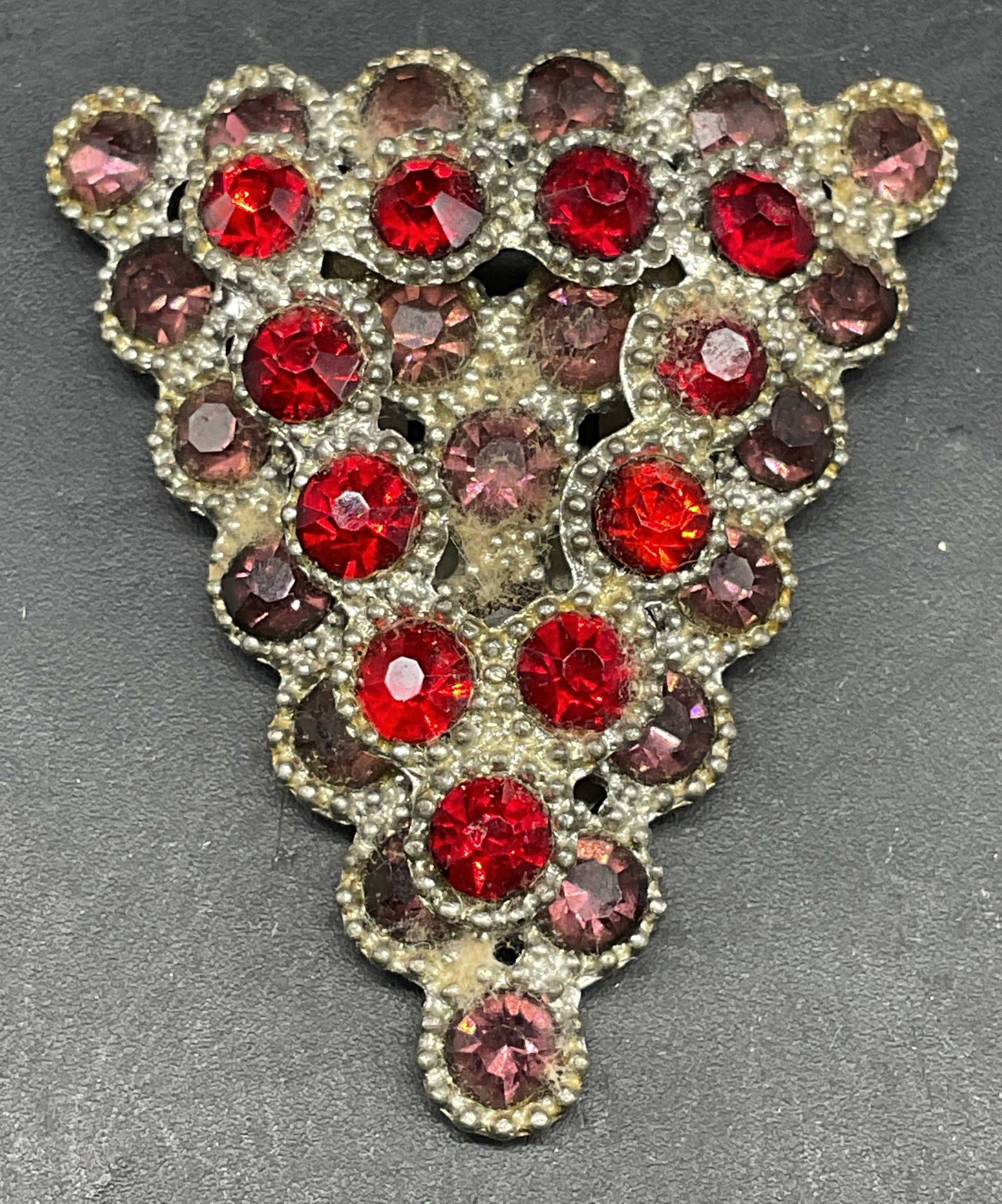 Vintage Red Rhinestone Triangle Fur Clip: Vintage silver tone and red rhinestone triangle shaped fur clip. Measures approx. 1.75 x 1.5 inches. Some scratching. Jewelry, estate jewelry, costume jewelry, cocktail jewelry, fashion jewelry, acces
