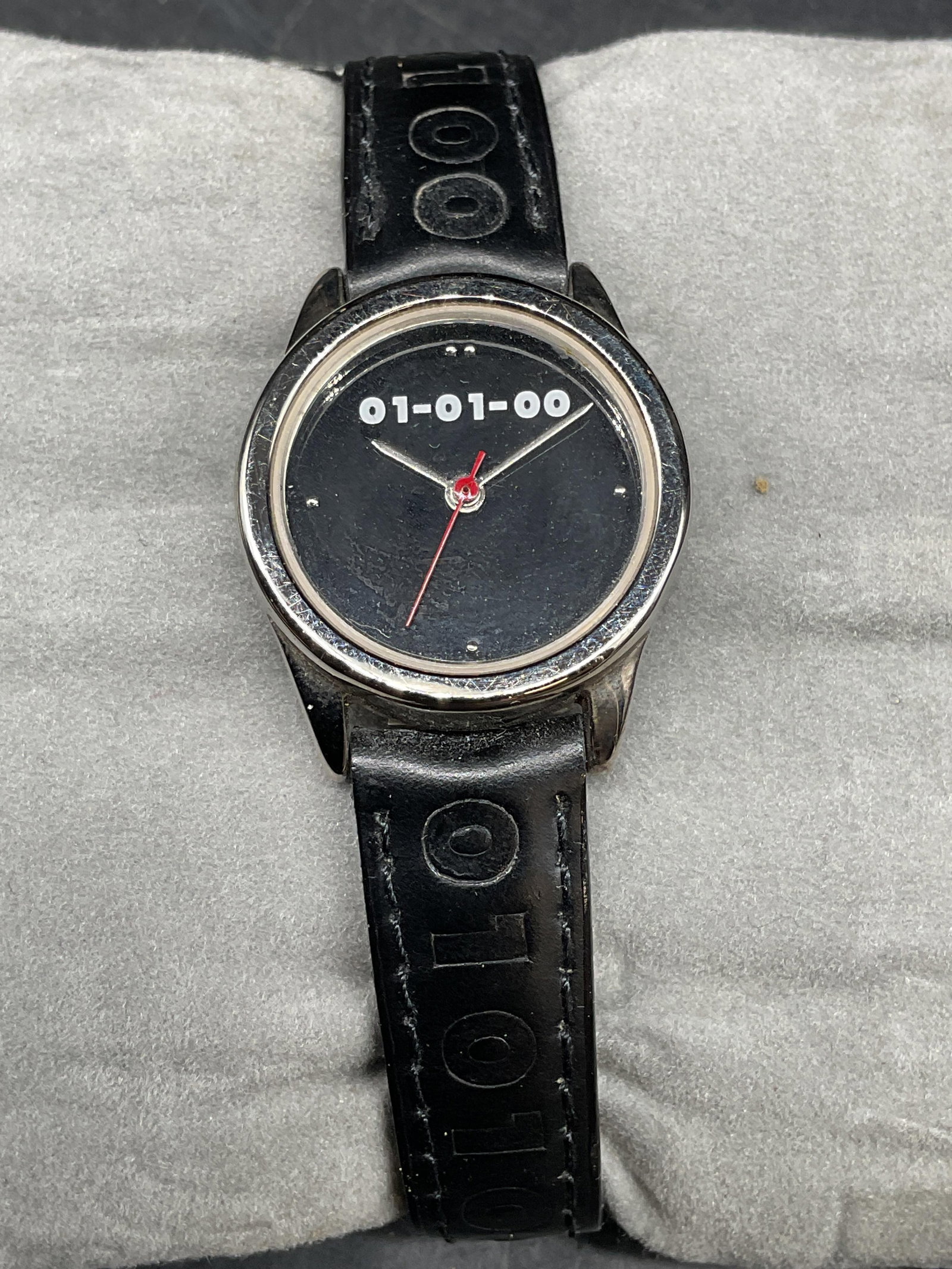01 01 00 Millennium Silver Tone Black Watch NWT: 01 01 00 The Mark Of The Millenium silver tone watch with black faux leather strap. Face measures approx. 1 inch wide. New without tag. Not tested. Some scratching. Jewelry, estate jewelry, costume