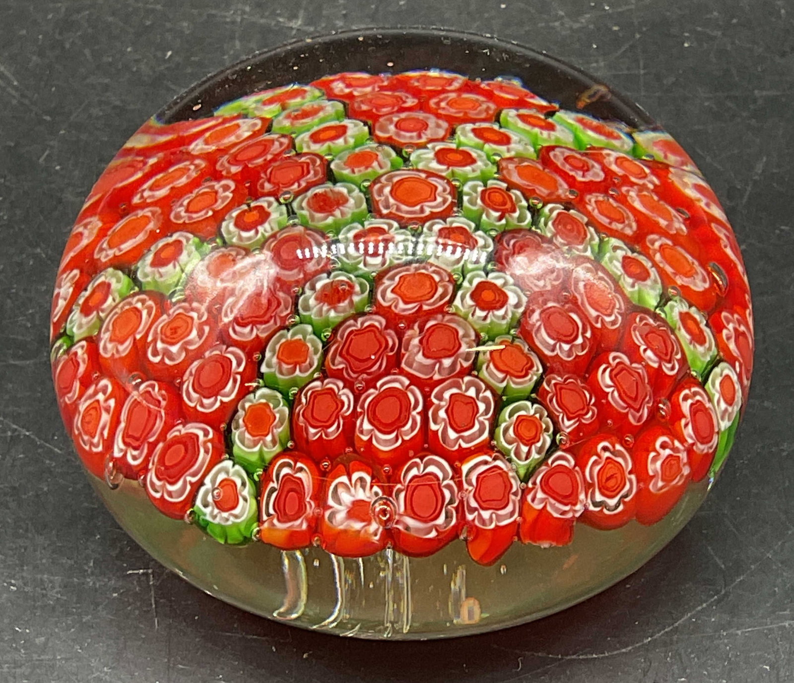 Millefiori Hand Blown Art Glass Paperweight: Millefiori hand blown art glass paperweight, red and green cased in clear glass. Measures approx. 4 x 3 inches. Some scratching. Art glass paperweight, millefiori paperweight, collectibles, home decor