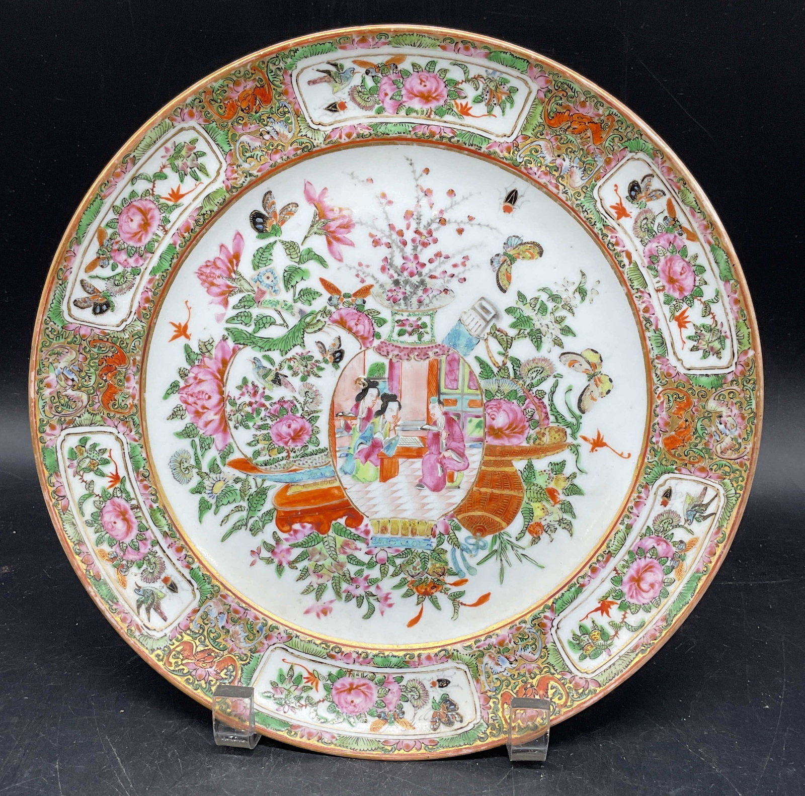 Antique Chinese Rose Medallion Porcelain Plate: Antique Chinese porcelain plate. Rose Medallion pattern. Hand enameled with ornate floral border and figural center. Measures approx. 9.75 inches. Wear including scratching, loss to paint, small hairl