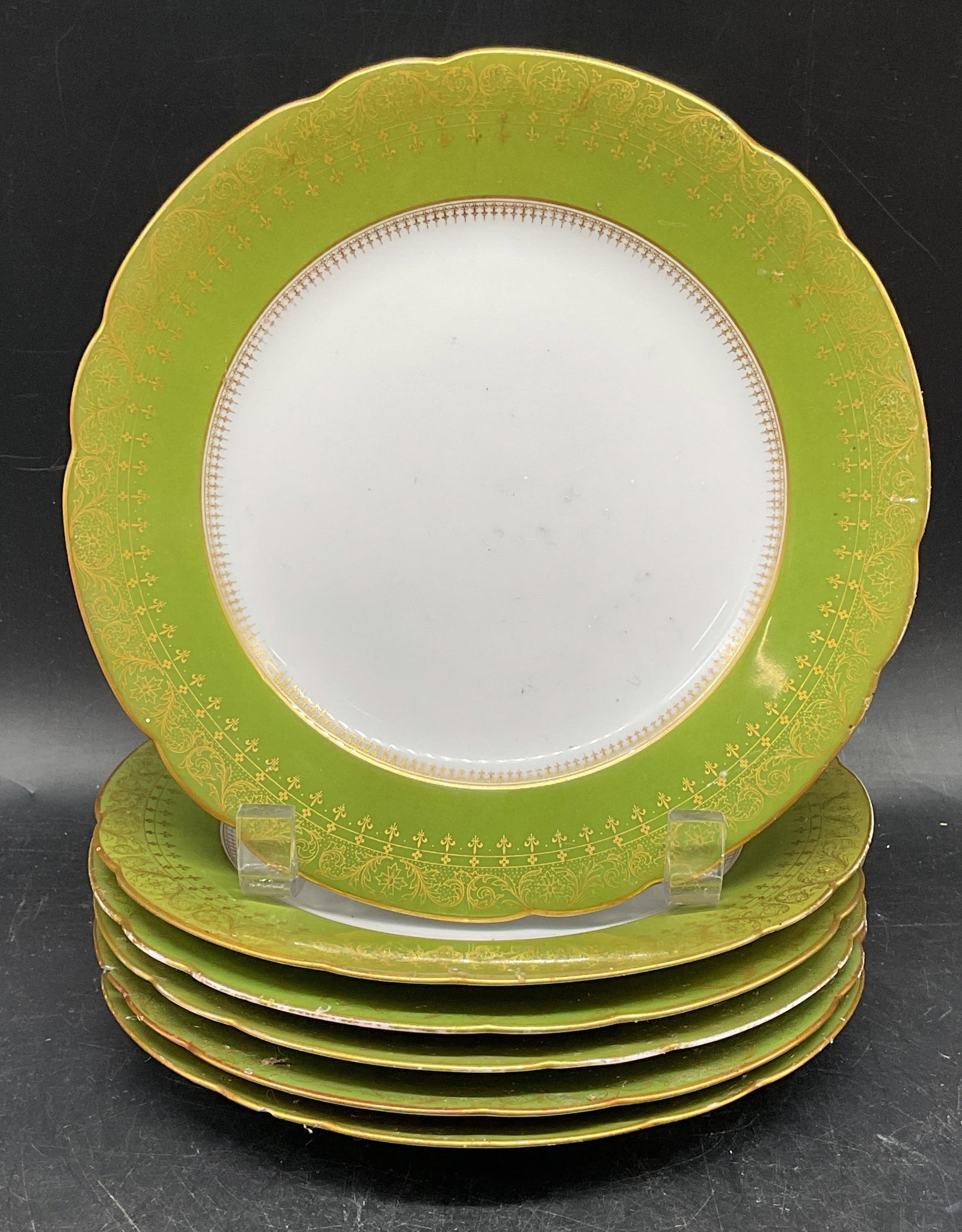 Set 6 Antique Green & Gilt Rim Porcelain Plates: Set of 6 antique porcelain plates with green and gilt scalloped rims. Measures approx. 8 inches wide. Some plates numbered. Some residue, scratching, loss to gilt. One plate has rim chips and hairline