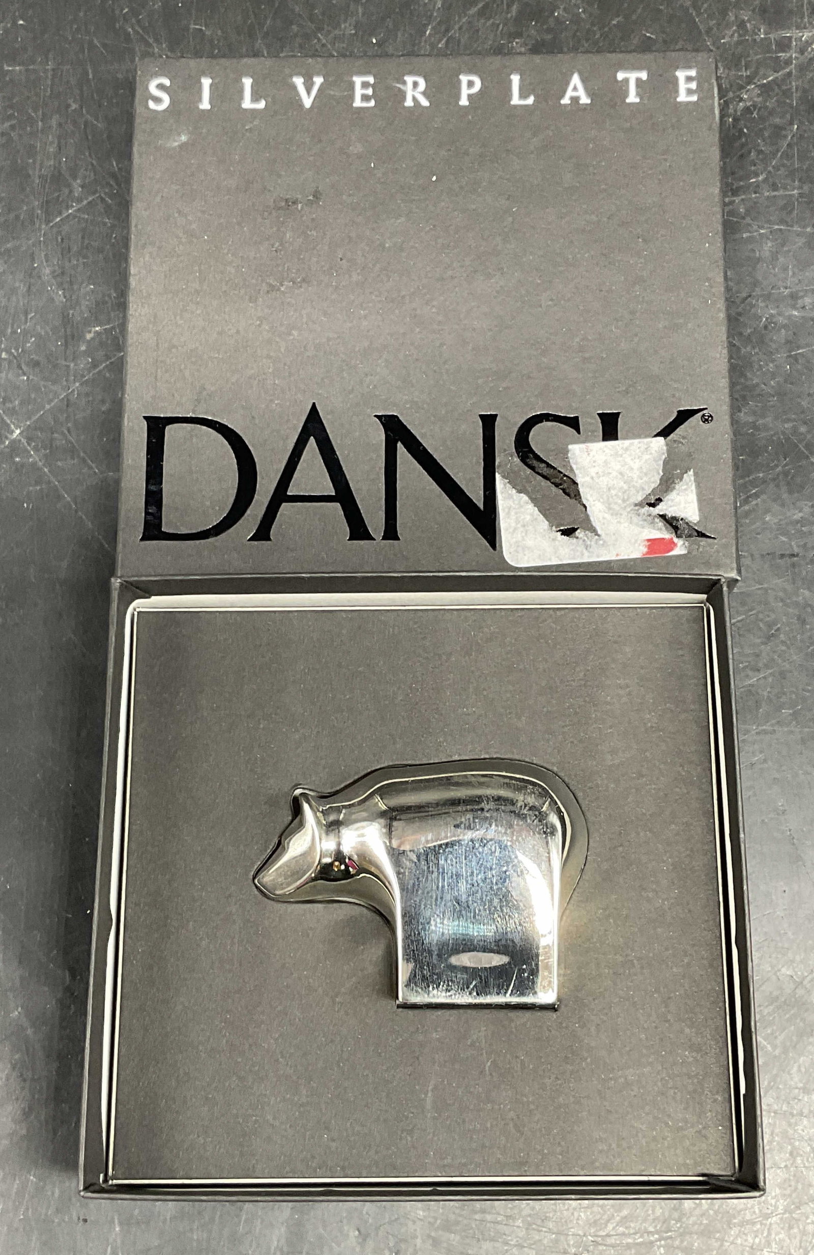 DANSK Brown Bear Silver Plated Figurine NIB: DANSK Brown Bear silver plated figurine. New in box. Measures approx. 2.5 x 1 x 1.75 inches. Some patina. DANSK figurine, bear figurine, silver plated figurine, collectibles, home decor, table decor, 