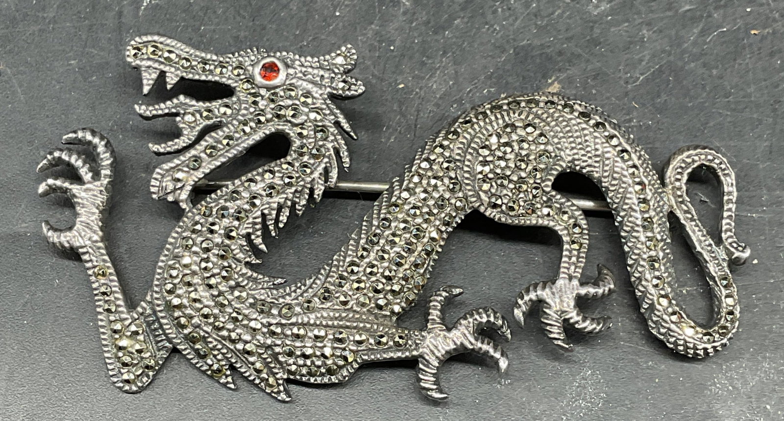 Vintage Sterling Silver Marcasite Dragon Brooch: Vintage sterling silver and marcasite dragon brooch. Marked sterling. Measures approx. 2.75 x 1.25 inches. Total weight 13.5 grams. Some scratching. Jewelry, estate jewelry, fine jewelry, cocktail jew