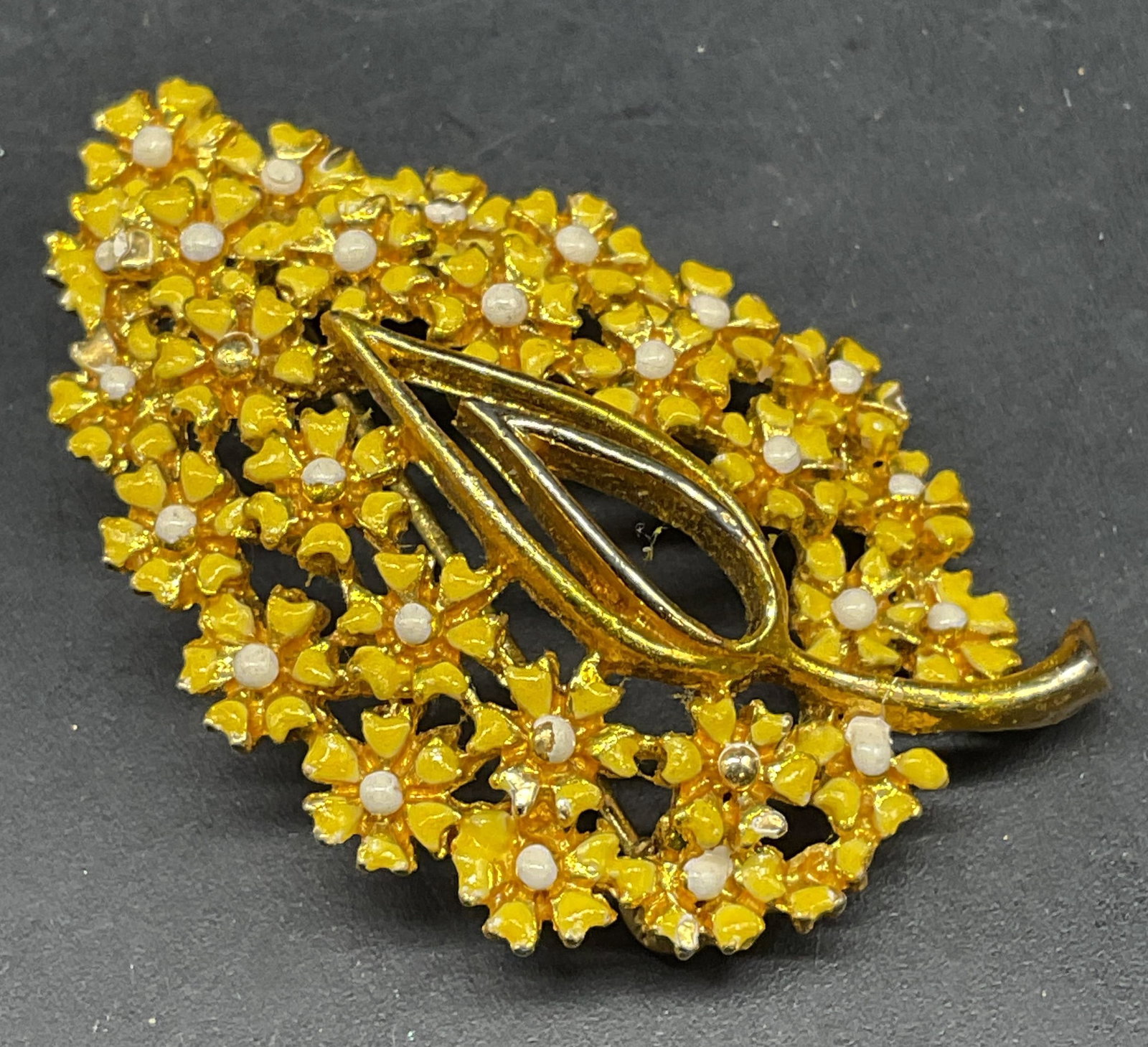 Vintage Yellow Enamel Flower Leaf Brooch: Vintage gold tone yellow enameled flower and leaf brooch. Measures approx. 1.75 x 1.25 inches. Some scratching. Jewelry, estate jewelry, costume jewelry, cocktail jewelry, fashion jewelry, accessories