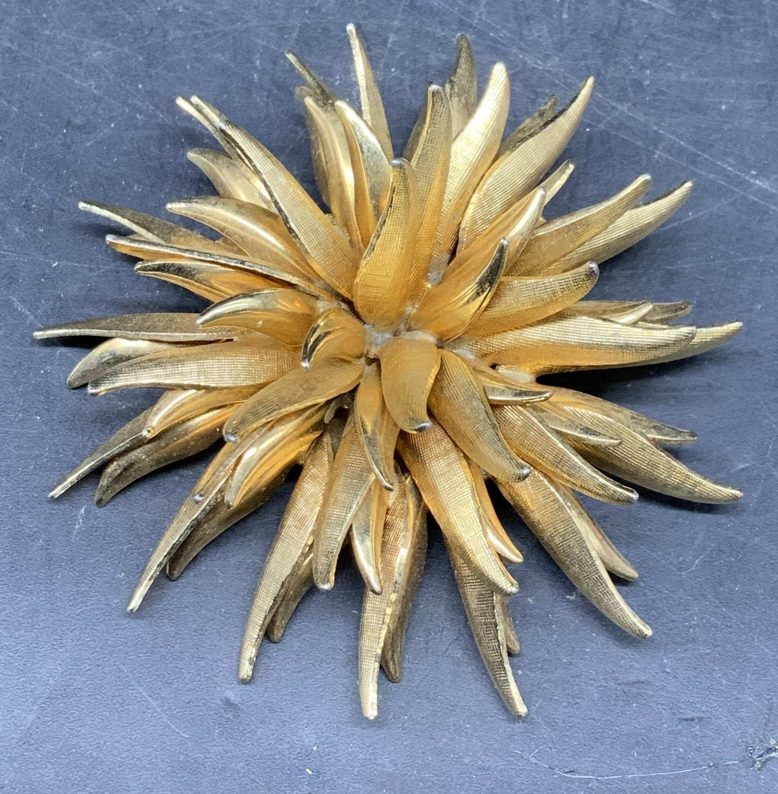 Vintage Brushed Gold Tone Flower Brooch: Vintage brushed gold tone flower brooch. Measures approx. 2.25 inches wide. Some scratching. Jewelry, estate jewelry, costume jewelry, cocktail jewelry, fashion jewelry, accessories, fashion accessori