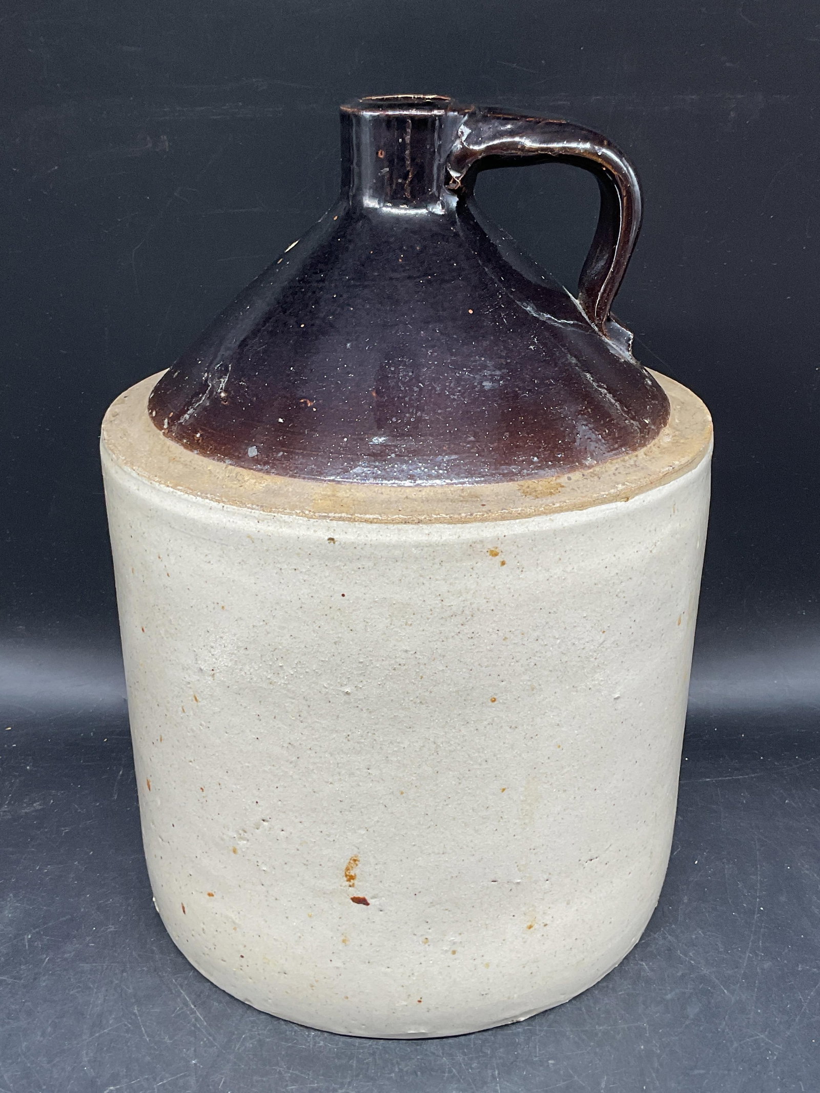 Antique Stoneware Whiskey Jug 12.5 Inches: Antique American style stoneware whiskey jug. Glazed brown and cream. Measures approx. 8.75 x 12.5 inches. Some scratching and small chips. Antiques, antique jug, whiskey jug, stoneware jug, collectib
