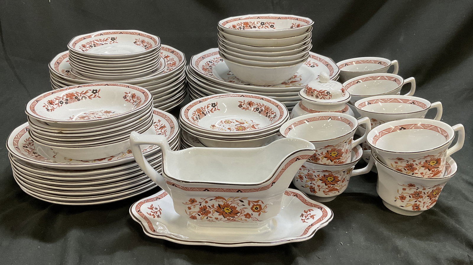 Lt71 Wedgwood Kashmar Dining Set ENGLAND: 71 Pieces of Wedgwood of Etruria & Barlaston Kashmar Dining Set. England. Porcelain with Red Floral Design. Intricate Red Rims. Includes 1 Gravy Boat with Attached Underplate, 6 Dessert Bowls, 8 Salad
