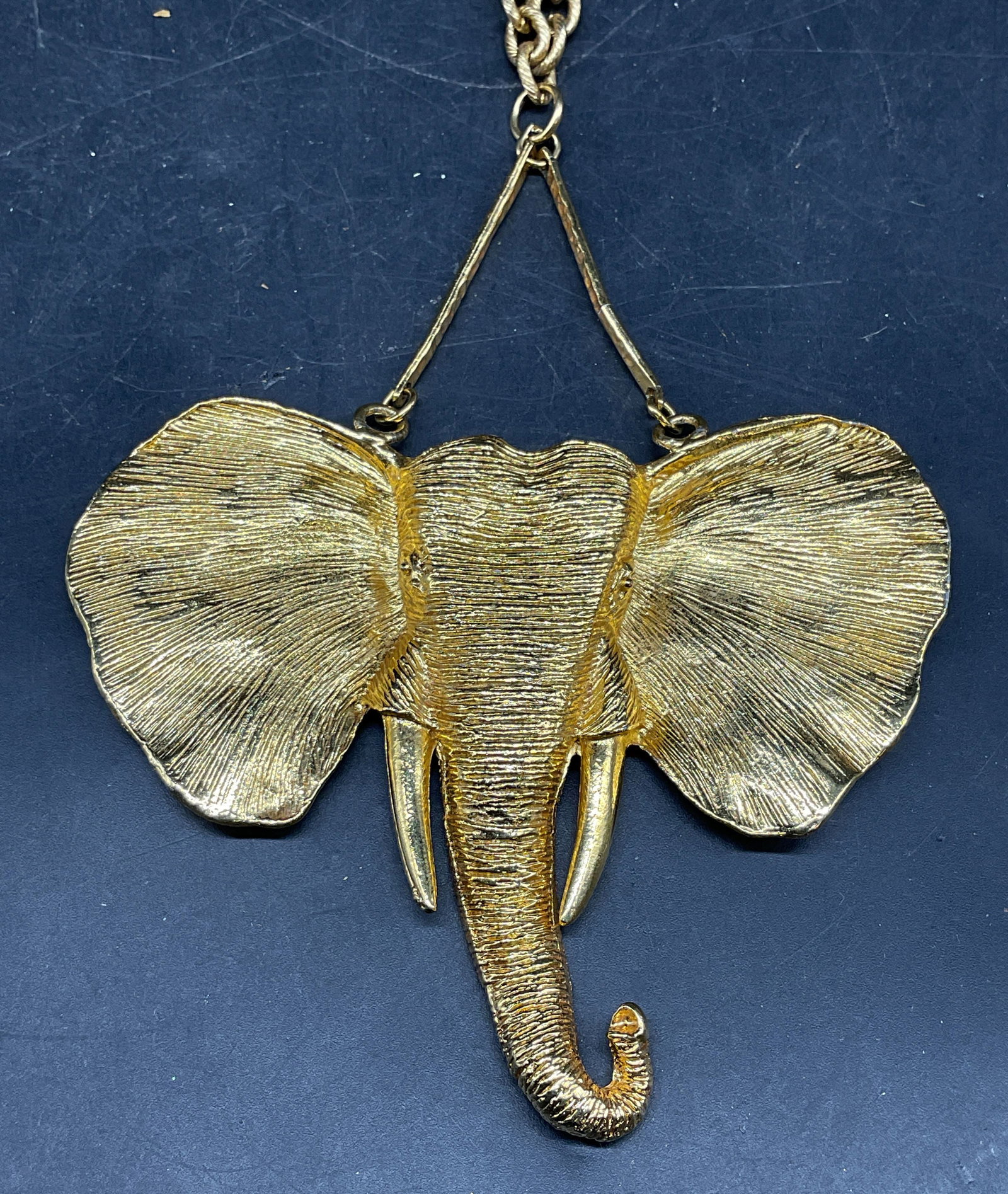 Gold Tone Elephant Statement Pendant Necklace: Gold tone statement necklace with elephant pendant. Drop length 12.5 inches. Pendant measures approx. 4 x 3.25 inches. Some scratching. Jewelry, estate jewelry, costume jewelry, cocktail jewelry, fash