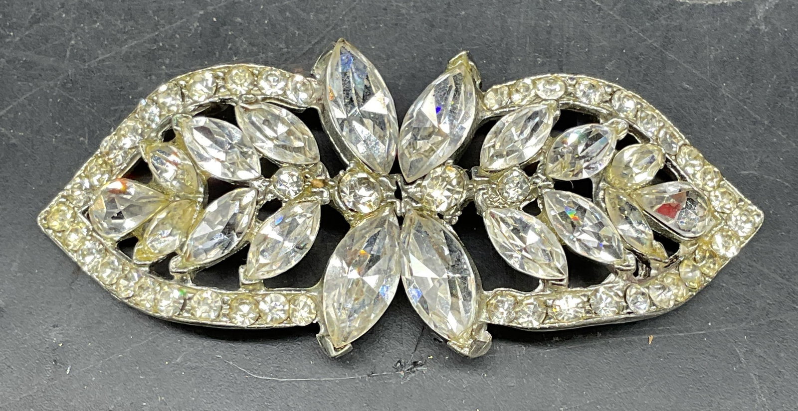 Vintage Silver Tone Rhinestone Leaf Buckle: Vintage two piece silver tone and rhinestone leaf buckle. Measures approx. 1.5 x 1.25 inches each. Some scratching. Jewelry, estate jewelry, costume jewelry, cocktail jewelry, fashion jewelry, accesso