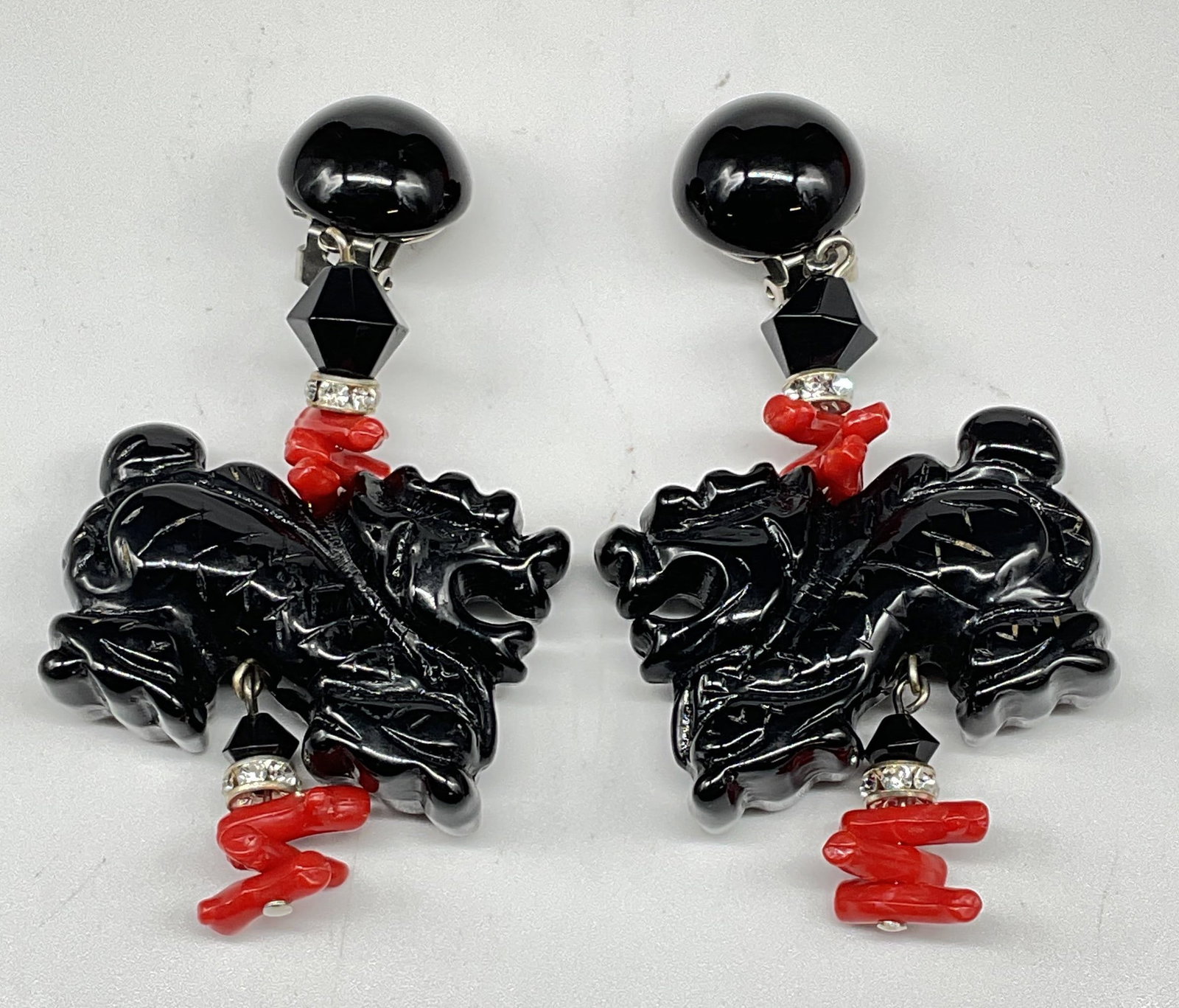 Vtg Black Lucite Dragon & Faux Coral Earrings: Vintage statement earrings. Black and red lucite with dragon and coral motif. Measures approx. 3.25 x 1.5 inches. Some scratching. Jewelry, estate jewelry, costume jewelry, cocktail jewelry, fashion j