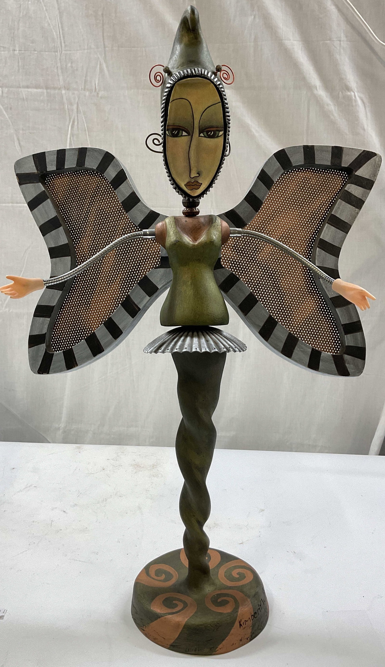 Sgnd Kimberly Wilcox Folk Art Sculpture 2ft: Signed at base, Kimberly Wilcox for Silvestri metal Dancer Figural from the Tickle Your Soul Collection, featuring moveable striped wings, twist able neck and head, whimsical hand painted details the 