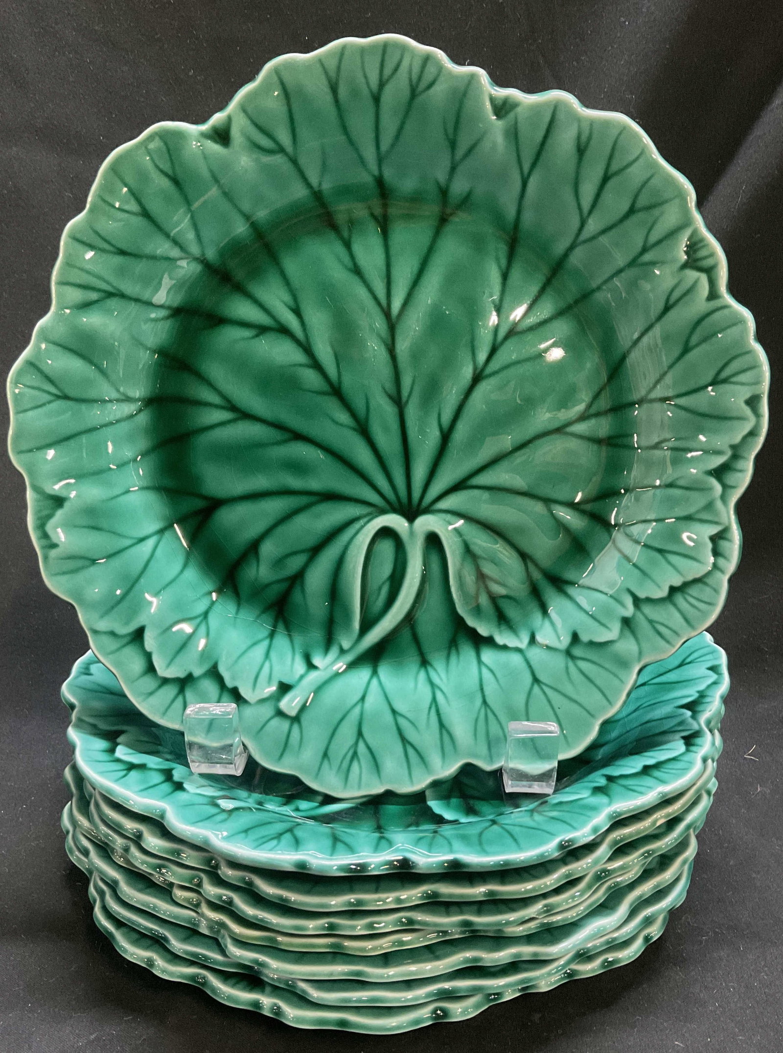 Lt8 VTG 50s Wedgwood Majolica Cabbage Plates ENGLD: 8 Vintage Circa Early 1950s Wedgwood Green Majolica Cabbage Leaf Plates. Scalloped Edges. Made in England. Crazing and Chips Present. Measures app 1in H x 8in L. Vintage Plates, 1950s, Wedgwood, Majol