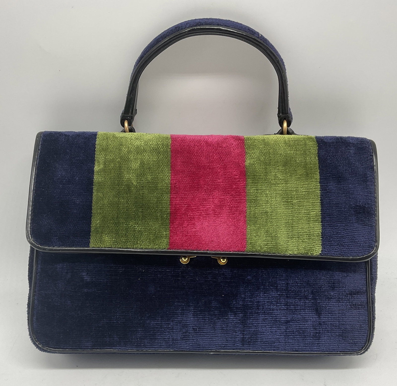 VTG Roberta di Camerino Velvet Handbag ITALY: Vintage Roberta di Camerino Handbag. Features Green and Pink Stripes on Navy Blue Velvet. Black Leather-Style Trim. Gold-Toned Metal Clasp. Some Fraying. Measures app 10.5in H x 10in L x 2.5in W. Vint