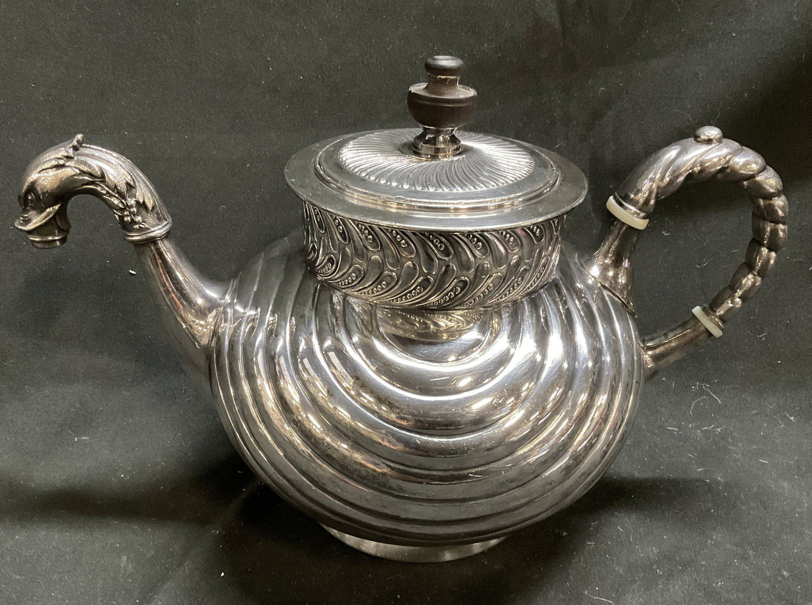 ANTQ Patd1888 Meriden Slvr-Pltd Dragon Teapot: Antique Victorian Patented 1888 Meriden Britannia Company Quadruple Silver-Plated Teapot. Dragon or Sea Serpent Shaped Spout and Handle. Fluted Body. Feathered Border. Contains Pop-Up Mechanism.