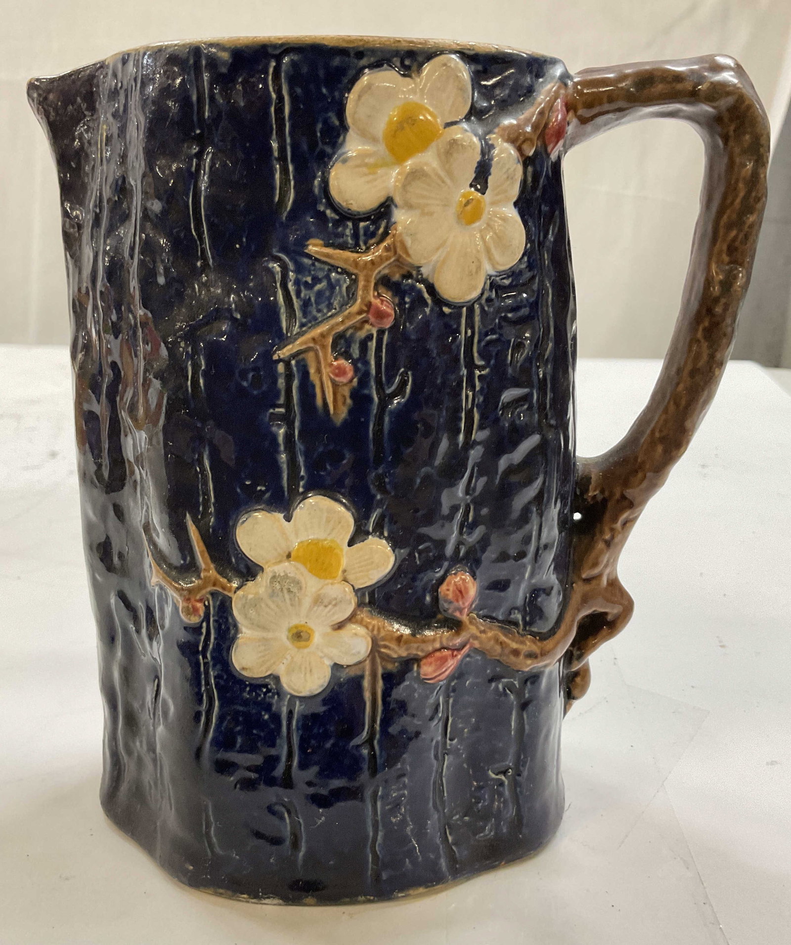 Antique Holdcroft English Majolica Ceramic Pitcher: Antique Holdcroft English Majolica ceramic Pitcher, markings on underside, produced by Joseph Holdcroft late 1800s, the design features a raised three dimensional dog tree branch motif on a textured c