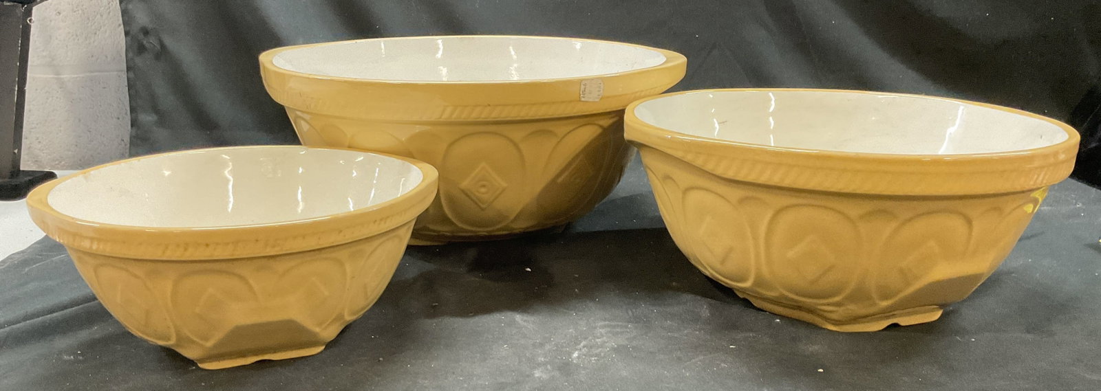 B. Altman Set 3Large Glazed Bowls, England: Set of three large yellow glazed nesting ceramic bowls, with B Altman Label affixed to exterior, one has underside that reads Gripstand, TG Green Ltd, made in England, vintage ceramic ware, vintage ta