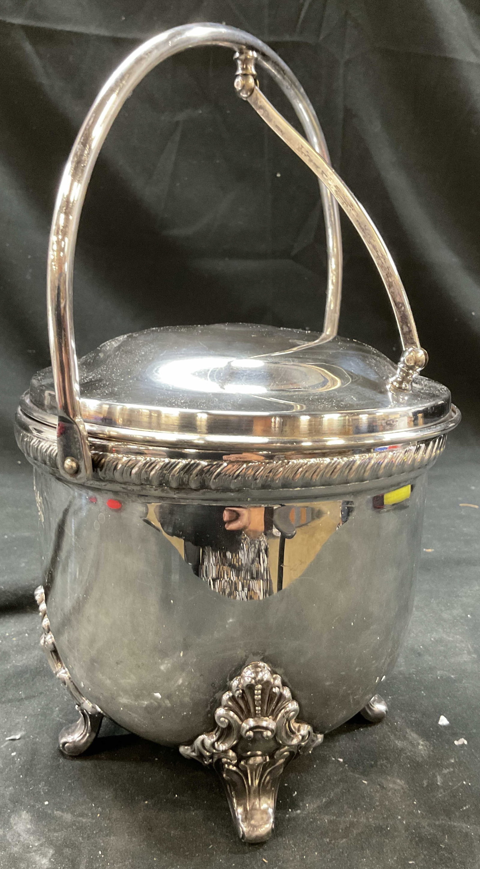 Vintg Bristol Silver Pl Ice Bucket w Liner: Signed Bristol and numbered on underside, Silver plate vintage ice bucket with scrolled feet, twist edging at lid, handle and center lid lift mechanism, lined , measures closed ht 13 inches, diameter 