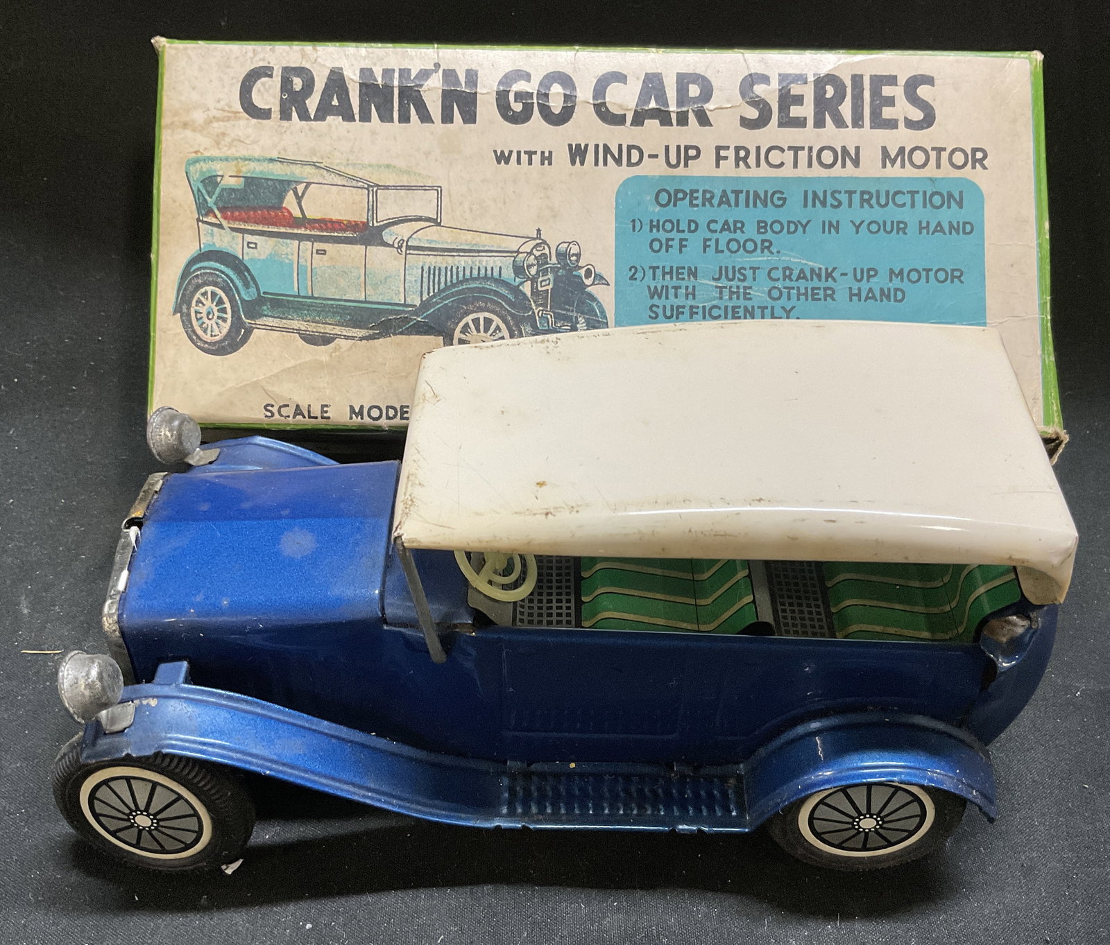 70s Crank N Go Scale Model Yesteryear Ford+ JAPAN: Vintage Circa 1970s Crank N Go Scale Model Yesteryear 1920s Ford Tinplate Car. Distributed by Frankonia. Comes with Original Illustrated Box. Wind-Up Fricton Motor. Aging to Metal and Box. Not Tested