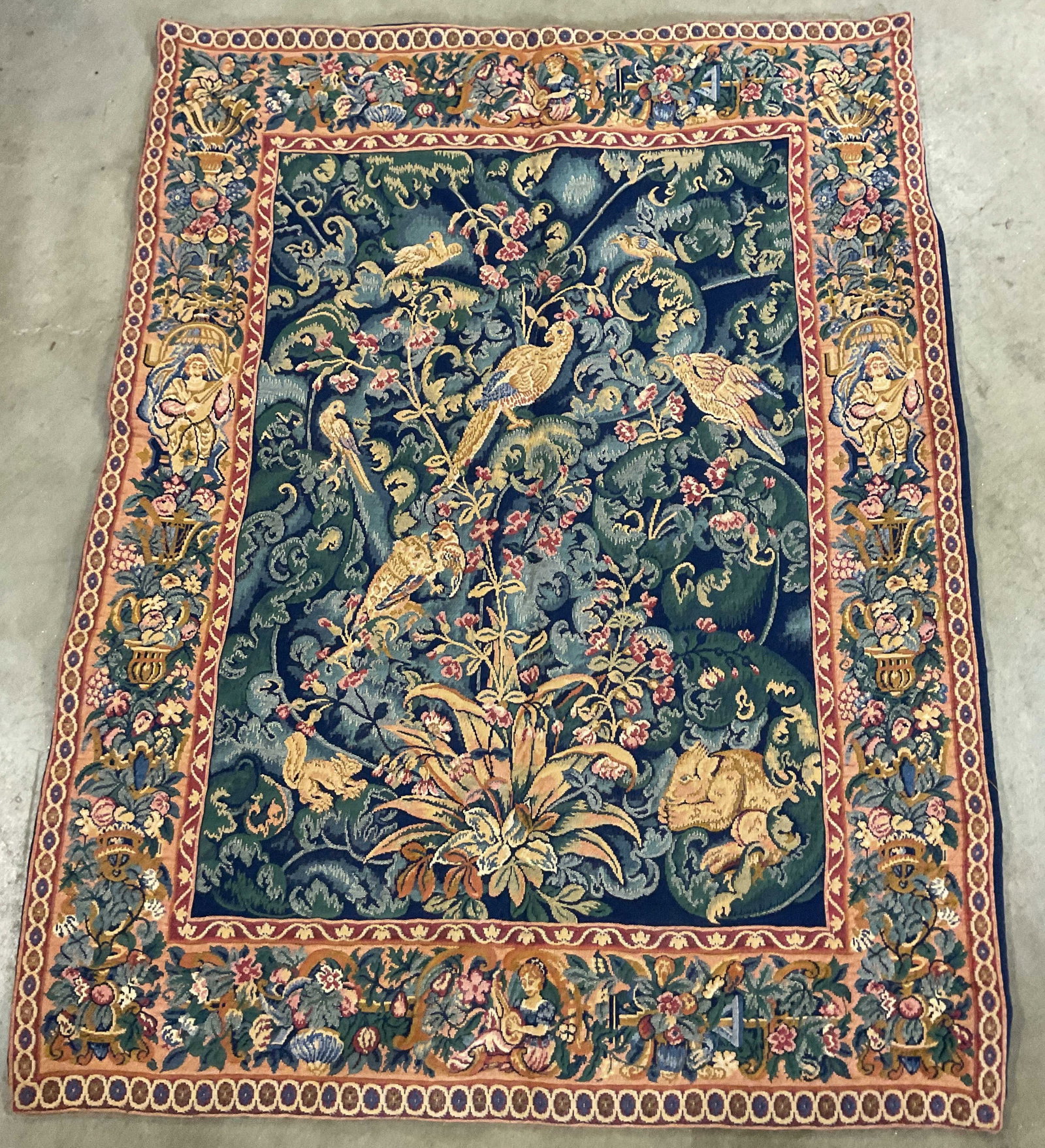 Woven Jacquard Wall Tapestry lions, Birds: Woven Jacquard Wall Tapestry with a traditional Franco Flemish Design, featuring large stylized leaves, blooming floral, wild birds and a crouching lion lower right, squirrels, wide decorative frame b