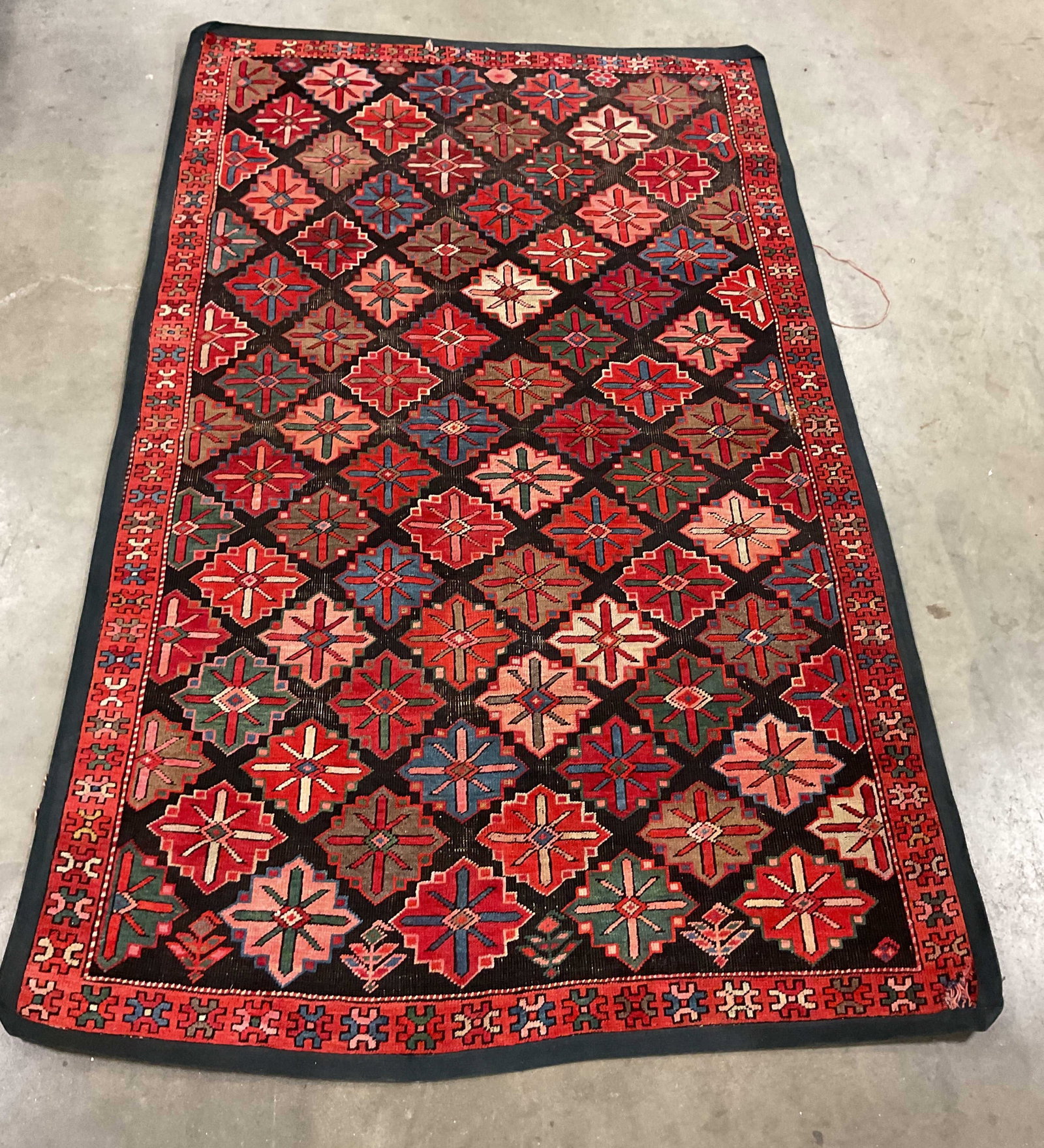 Vntg Caucasian Style Tribal Flat Weave Rug: Caucasian style flat weave rug featuring a prominent diamond lattice pattern geometric designs, , bright reds, turquoise, blues greens and creams, wool carpet, measures app 84 by 55 inches, carpets