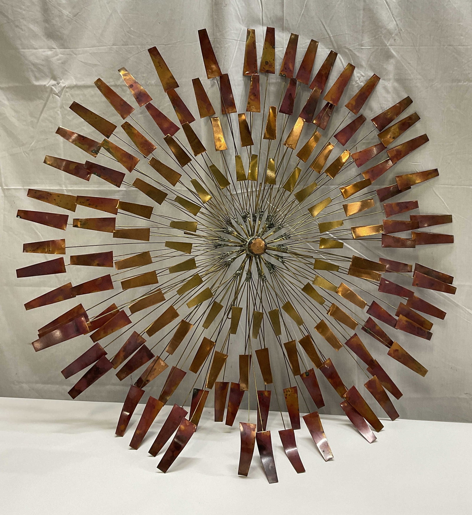 1999 SGND A.Duerst Sunburst Metal Art Sculpture: Vintage 1999 Signed A. Duerst Sunburst Metal Art Sculpture. Brutalist Style. Brass Core That Spirals Outward to Tiers of Various Shades of Copper and Torched Metal. Verdigris Patina Present. Measures 