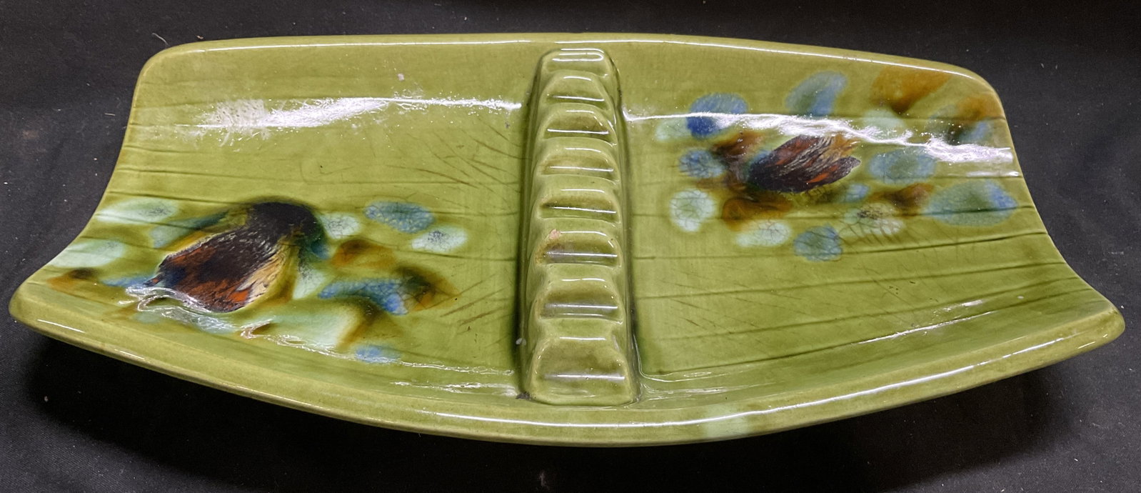 MCM SGND DeForest CA Pottery Ceramic Ashtray: Mid-Century Modern Circa 1950s-1960s Signed DeForest California Pottery Ceramic Ashtray. #201. Avocado Green with Blue and Brown Lava Glaze. Ridged Cigarette Holder Divider. Chips Present. Measures ap