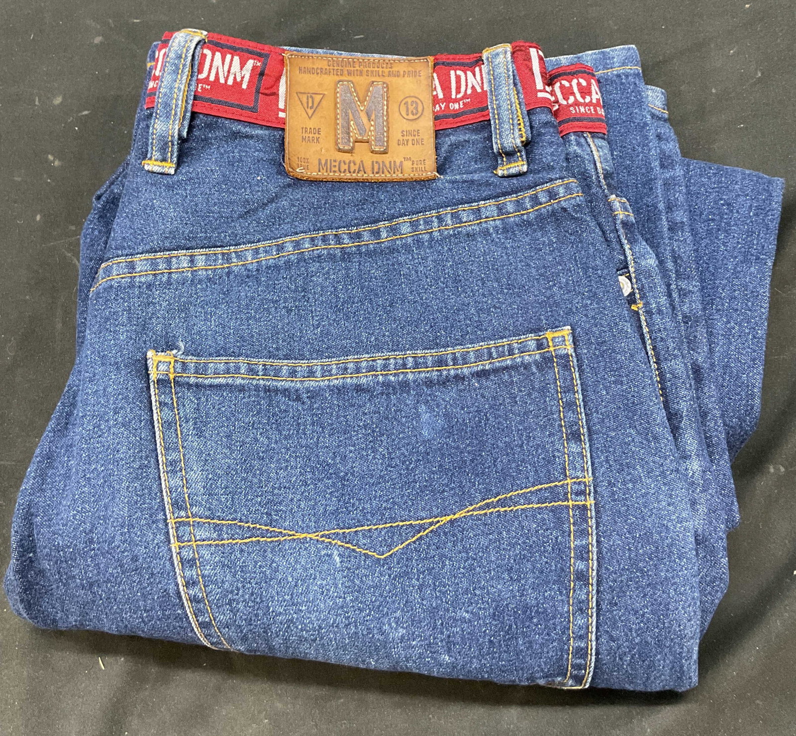 Mecca DNM Dark Wash Denim Jeans Hong Kong: Mecca DNM dark wash denim jeans. Made in Hong Kong. Size 30. 100% cotton. Red decorated waistband. Wear consistent with exposure. Jeans, pants, bottoms, Mecca DNM, wearables, clothing, outerwear, fash