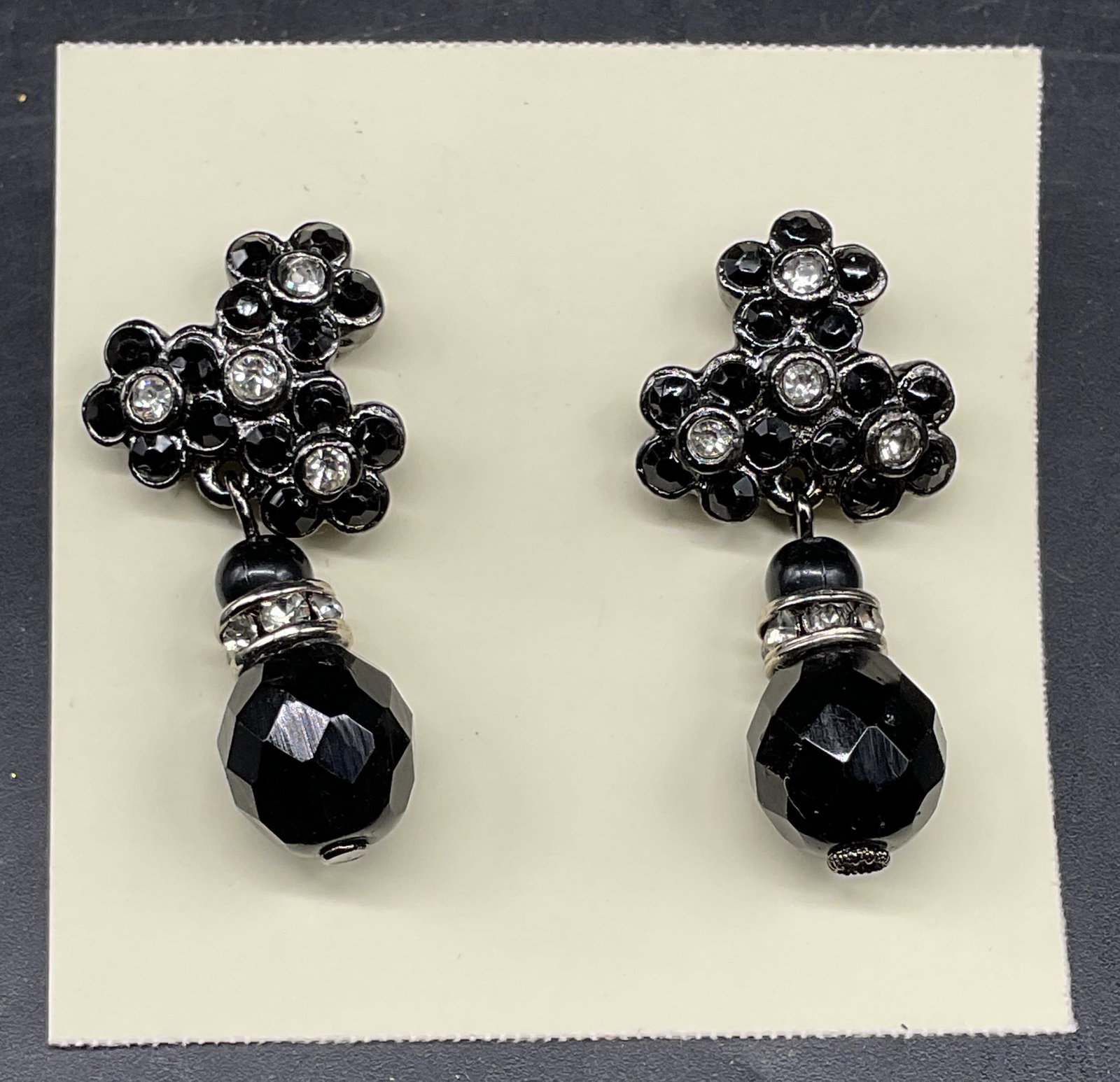 Vintage Black Rhinestone Flower Earrings: Vintage silver tone black rhinestone flower earrings. Measures approx. 1.25 inches long. Some scratching. Jewelry, estate jewelry, costume jewelry, cocktail jewelry, fashion jewelry, accessories, fash