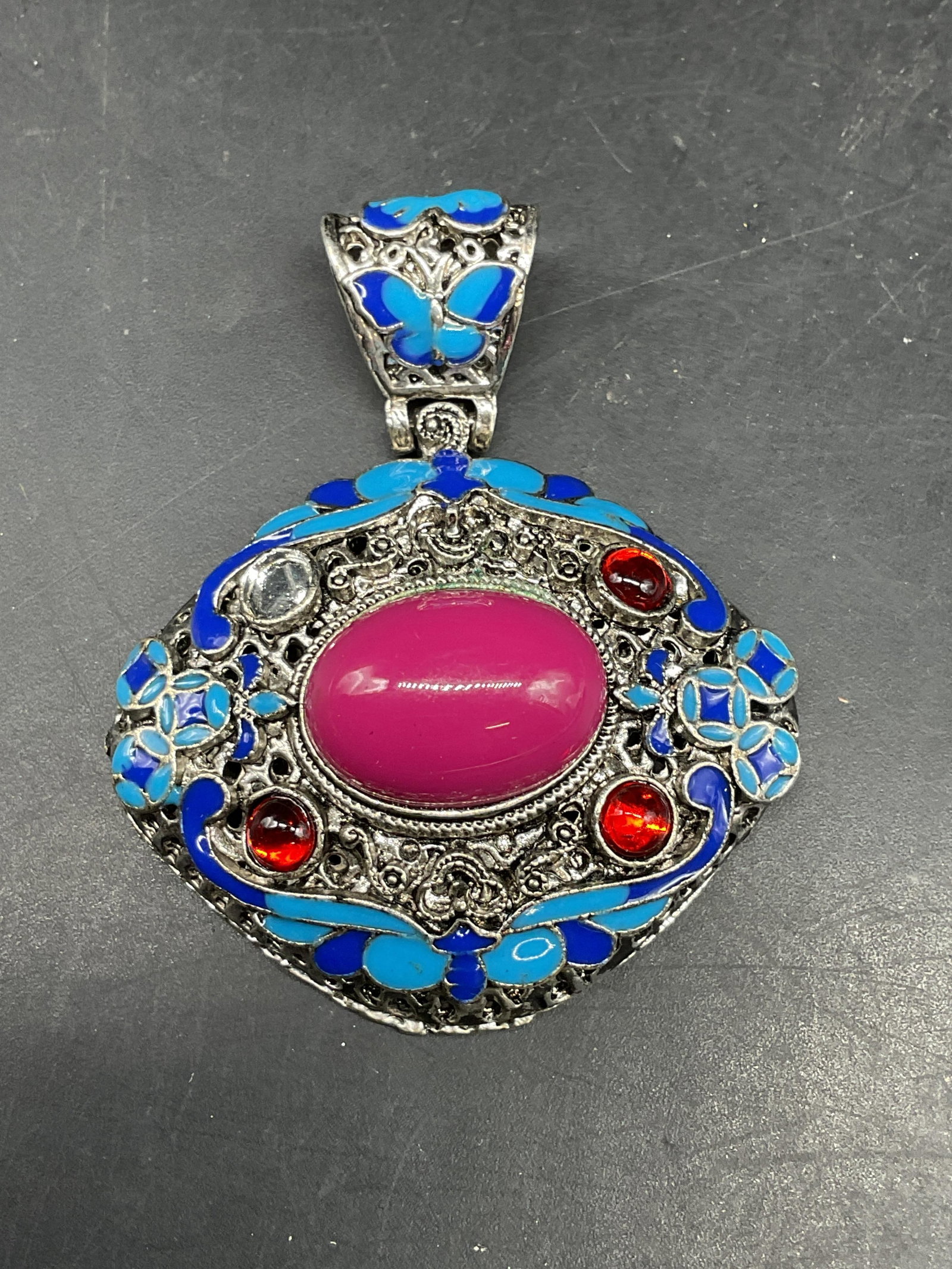 Silver Tone Pink Lucite Statement Brooch: Silver tone blue enamel, pink and red lucite statement pendant. Measures approx. 2.25 x 2 inches. Some scratching. One piece needs replacement. Jewelry, estate jewelry, costume jewelry, cocktail jewel